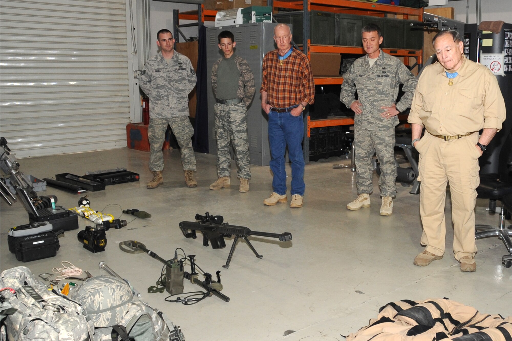 Medal of Honor winners Don Jenkins and Alfred V. Rascon view a presentation by the 380th Civil Engineer Squadron, Explossive Oridence Disposal shop at an undisclosed location in Southwest Asia on April 12, 2010. The 380th Air Expeditionary Wing, supports Operations Iraqi Freedom and Enduring Freedom and the Combined Joint Task Force-Horn of Africa. The 380th AEW is comprised of four groups and 12 squadrons and the wing's deployed mission includes air refueling, surveillance and reconnaissance in support of overseas contingency operations in Southwest Asia. (U.S. Air Force photo/Senior Airman Jenifer H. Calhoun/Released)
