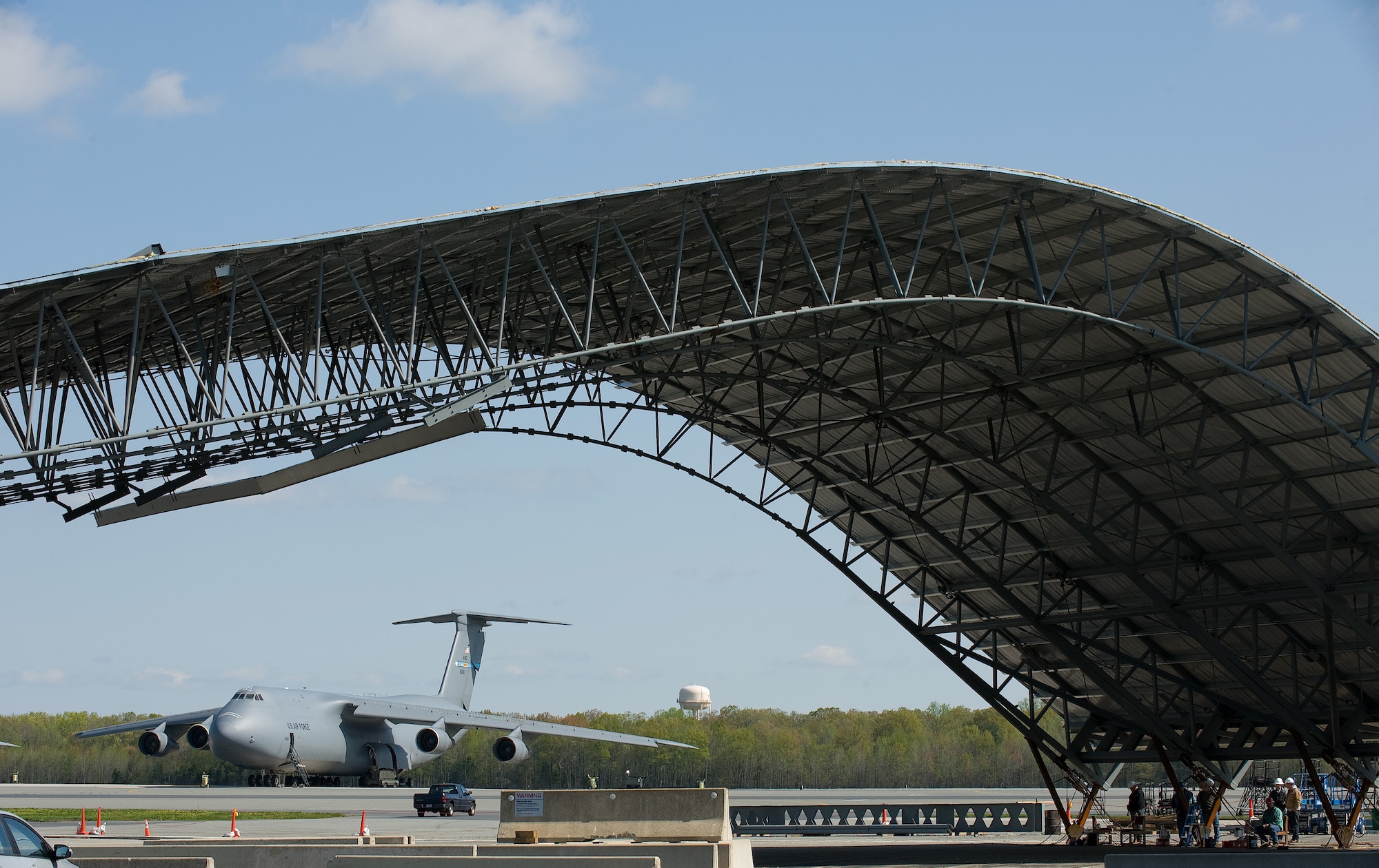 A Mobile Tail Enclosure is moved from a flat to a standing position April 10.  The new MTE will help enclose the tail of the aircraft to protect it from inclimate weather, which use to prevent maintenance crews from working on the aircraft.  The MTE is estimated to save over 248 hours of lost time a year.  (U.S. Air Force photo/Jason Minto)