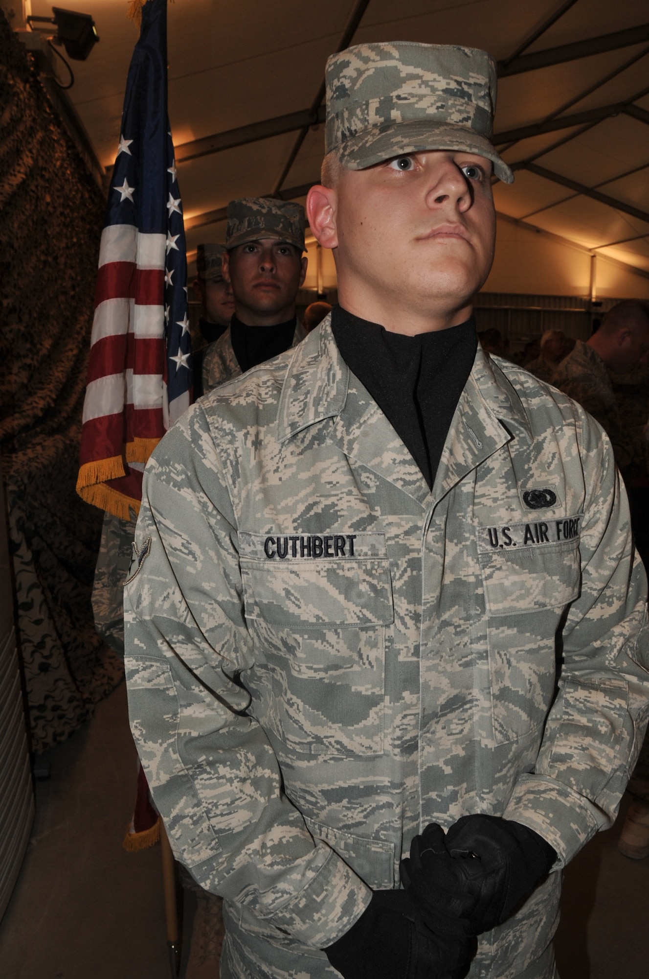 Airman Kasey Cuthbert, a material management apprentice with the 380th Expeditionary Logistics Readiness Squadron, leads participation by the 380th Air Expeditionary Wing Honor in the Medal of Honor Dining In held on April 12, 2010, at a non-disclosed base in Southwest Asia. Airman Cuthbert is deployed from the 366th Logistics Readiness Squadron at Mountain Home Air Force Base, Idaho, and his hometown is Massillon, Ohio. (U.S. Air Force Photo/Master Sgt. Scott T. Sturkol/Released)