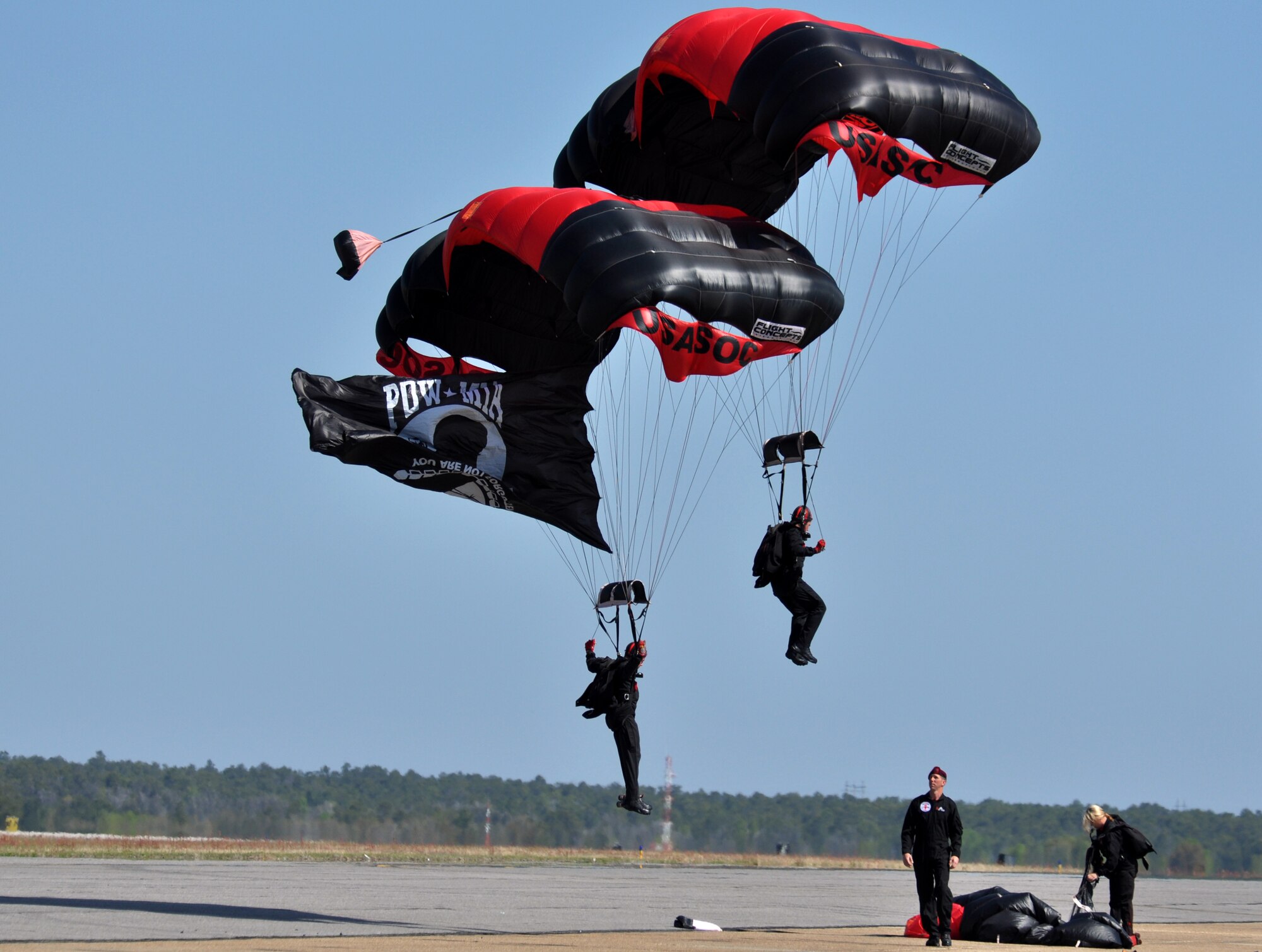 EGLIN AIR FORCE BASE, Fla. –Two members of the Army Black Daggers touchdown in the landing zone during the 75th Anniversary Air Show April 11. More than 125,000 were in attendance during the air show April 10-11, enjoying a variety of aerial performances and static displays. This was Eglin’s first open house since 2007 and was timed to coincide with the 75th anniversary of the installation. The Thunderbirds, F-22A Raptor demo and “Tora, Tora, Tora” were some of the highlights of the event. (U.S. Air Force photo/ Airman 1st Class Anthony Jennings)