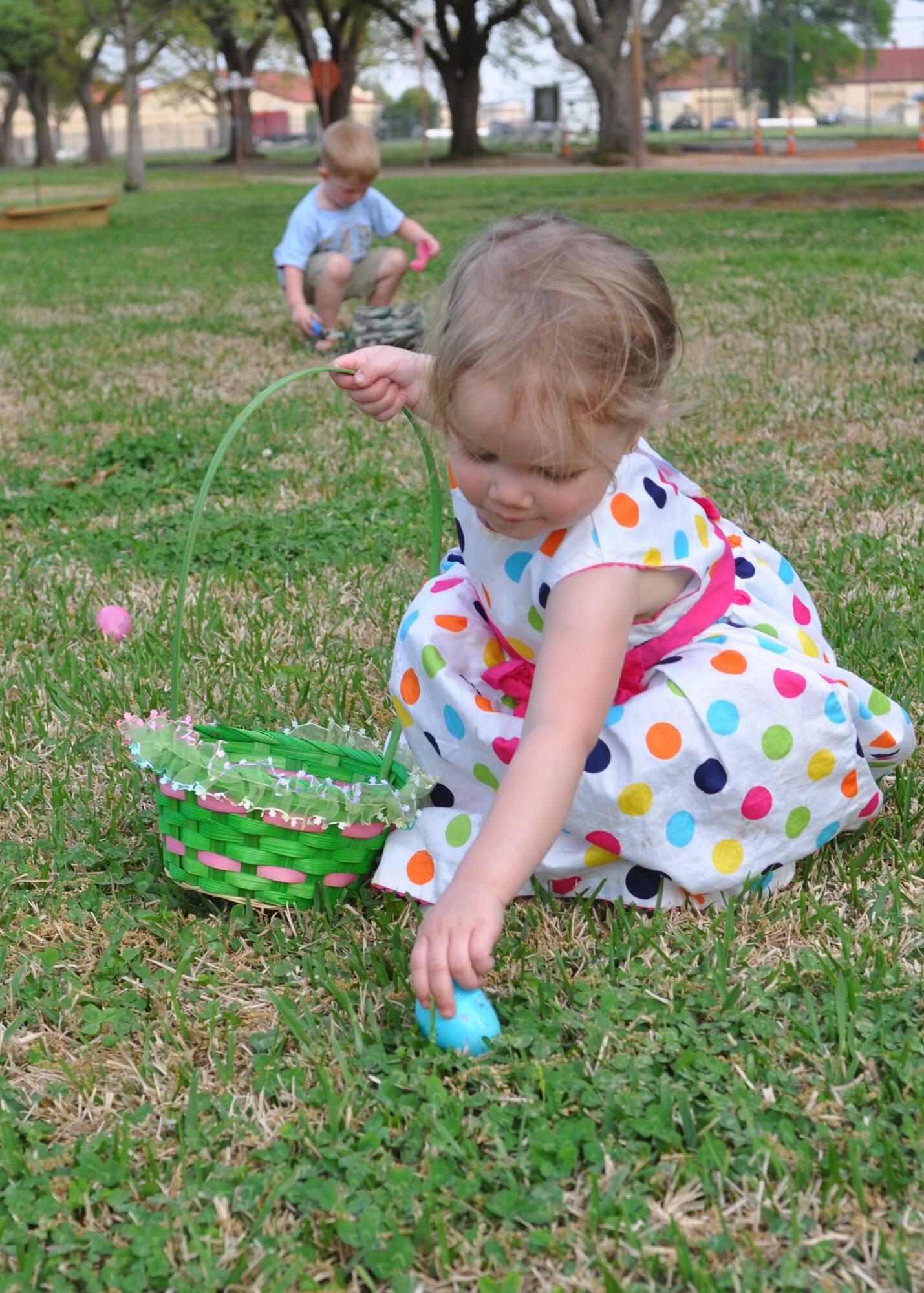 Amirah Jordan, the daughter of a public affairs representative for the 917th Wing on Barksdale Air Force Base, La., reaches down to claim another egg during Stephanie Willey’s Daycare Easter Egg Hunt on April 2, 2010. Amirah attends the on-base daycare and is also the daughter of a heating, ventilation and air conditioning technician for the 2nd Civil Engineering Squadron here.  (U.S. Air Force Photo/Senior Airman Crystal Marie Jordan)