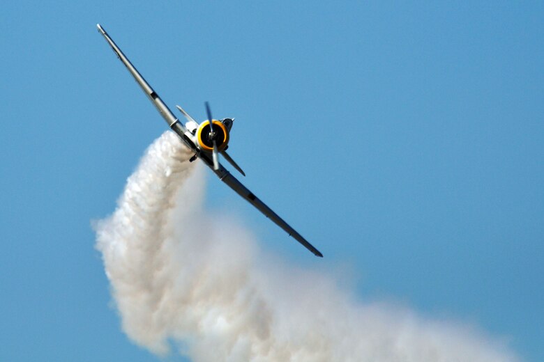 EGLIN AIR FORCE BASE, Fla. – A T-6 Texan performs acrobatic maneuvers during the 75th Anniversary Air Show April 11. More than 125,000 were in attendance during the air show April 10-11, enjoying a variety of aerial performances and static displays. This was Eglin’s first open house since 2007 and was timed to coincide with the 75th anniversary of the installation. The Thunderbirds, F-22A Raptor demo and “Tora, Tora, Tora” were some of the highlights of the event. (U.S. Air Force photo/ Airman 1st Class Anthony Jennings)