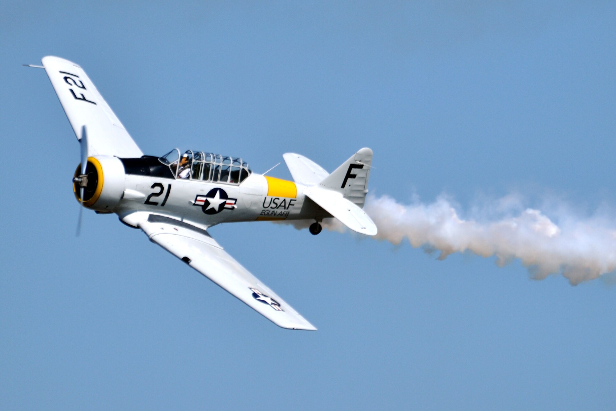 EGLIN AIR FORCE BASE, Fla. – A T-6 Texan performs acrobatic maneuvers during the 75th Anniversary Air Show April 11. More than 125,000 were in attendance during the air show April 10-11, enjoying a variety of aerial performances and static displays. This was Eglin’s first open house since 2007 and was timed to coincide with the 75th anniversary of the installation. The Thunderbirds, F-22A Raptor demo and “Tora, Tora, Tora” were some of the highlights of the event. (U.S. Air Force photo/ Airman 1st Class Anthony Jennings)