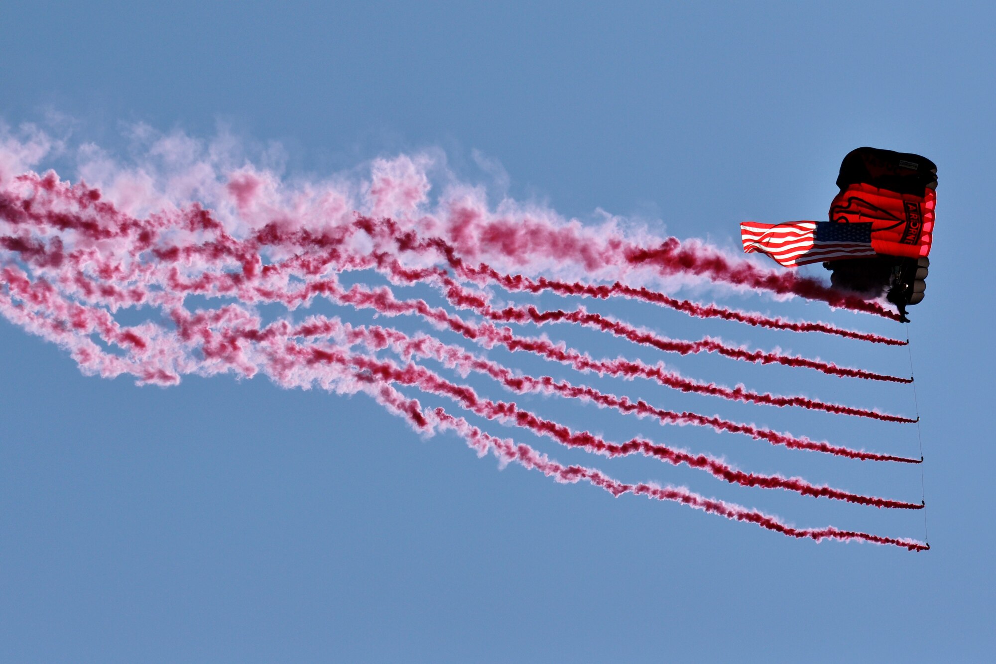 EGLIN AIR FORCE BASE, Fla. – A member of the Army Black Daggers leaves a trail of smoke before gliding into the landing zone during the 75th Anniversary Air Show April 11. More than 125,000 were in attendance during the air show April 10-11, enjoying a variety of aerial performances and static displays. This was Eglin’s first open house since 2007 and was timed to coincide with the 75th anniversary of the installation. The Thunderbirds, F-22A Raptor demo and “Tora, Tora, Tora” were some of the highlights of the event. (U.S. Air Force photo/ Airman 1st Class Anthony Jennings)