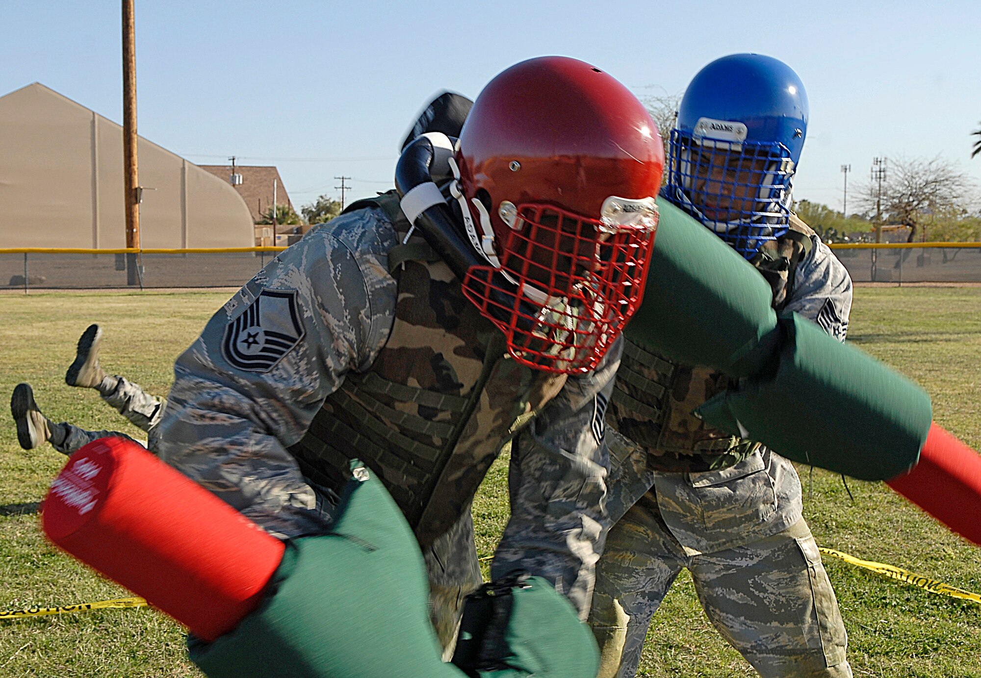 Staff Sgt. Jesus Artesi (right) hits Master Sgt. Glen Presswood with a pugil stick during a military combative training course April 6, 2010, at Luke Air Force Base, Ariz. The combative training course began April 1, 2010, and will continue until April 23, 2010. Sergeant Presswood is a 61st Aircraft Maintenance Unit support flight chief. Sergeant Artesi is a 56th Medical Support Squadron information technology specialist. (U.S. Air Force photo/Airman 1st Class Ronifel Yasay)