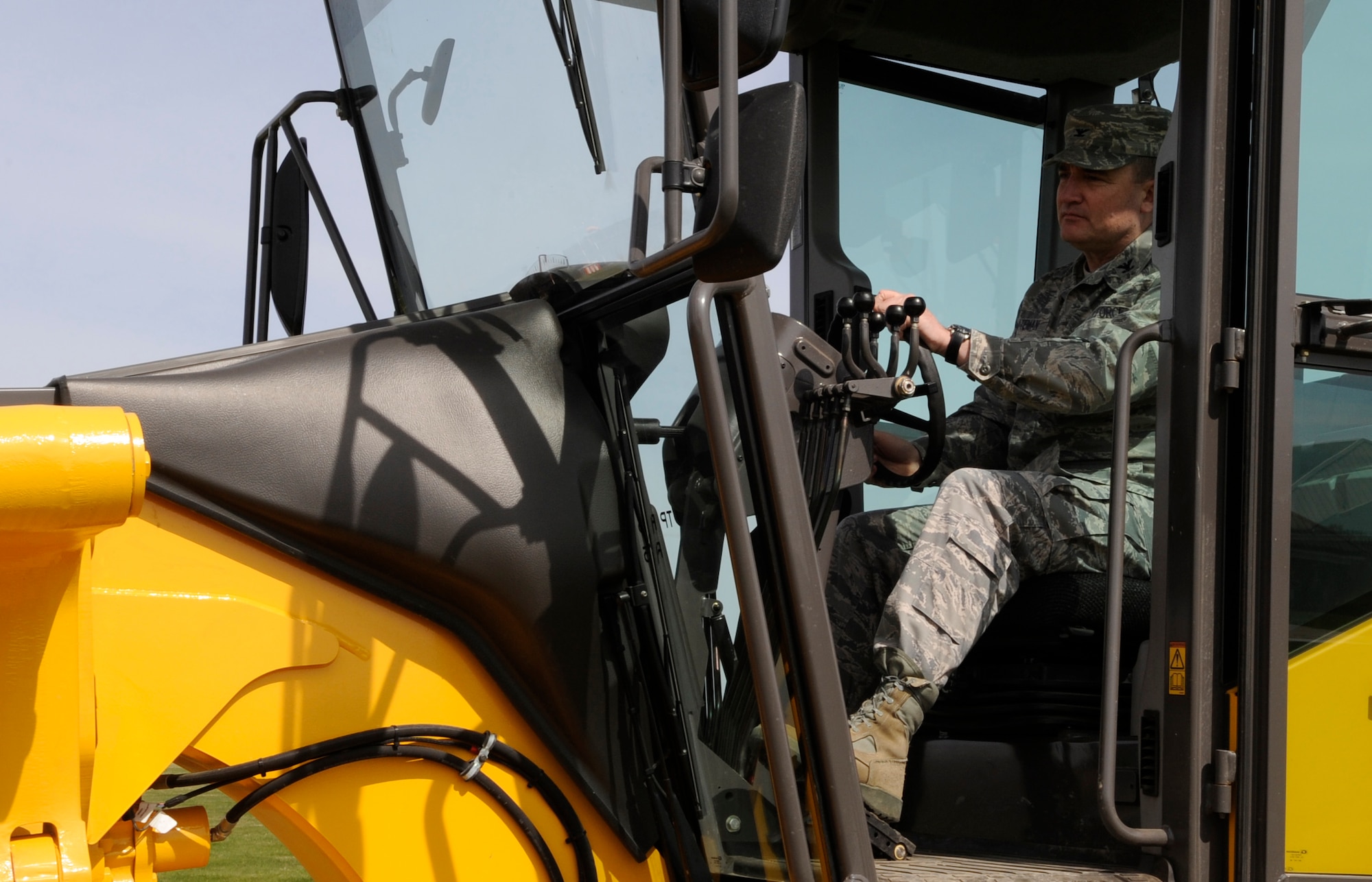 RAF MILDENHALL, England – Col. Jeffery Bateman, 100th Mission Support Group commander, drives a grader April 13 as an effort to experience the jobs of those he commands.  Colonel Bateman also tried his hand at fire suppression and bulldozer driving.  (U.S. Air Force photo/Staff Sgt. Christopher L. Ingersoll)