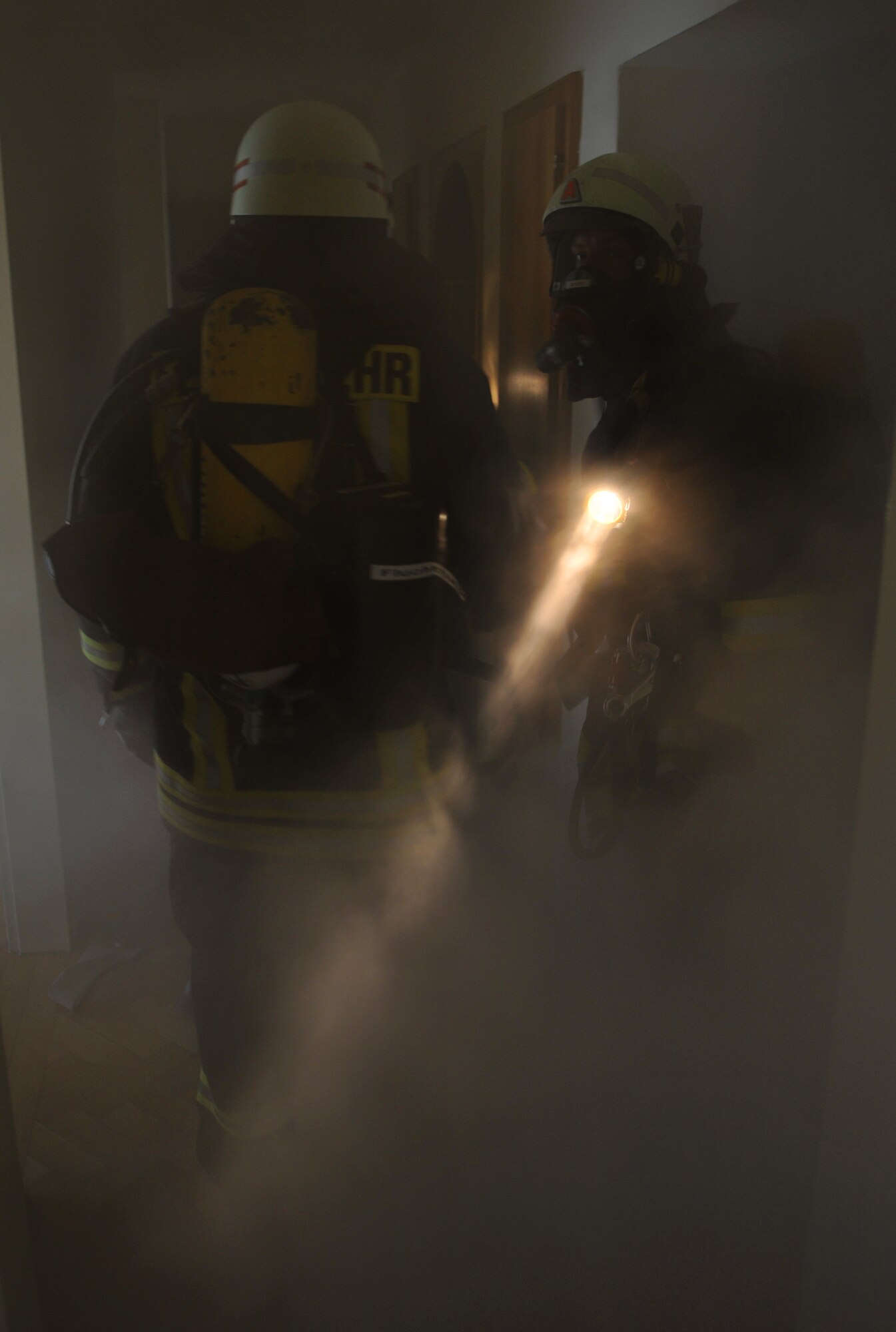 SPANGDAHLEM AIR BASE, Germany – Firefighters from the Bitburg Freiwilige Feuerwehr fire department respond to a simulated building fire during a mutual aid exercise at Bitburg Annex April 11. The exercise tested the 52nd Fighter Wing and Bitburg Freiwilige Feuerwehr fire departments’ ability to work together and respond to real-world fire emergencies. (U.S. Air Force photo/Airman 1st Class Nick Wilson)
