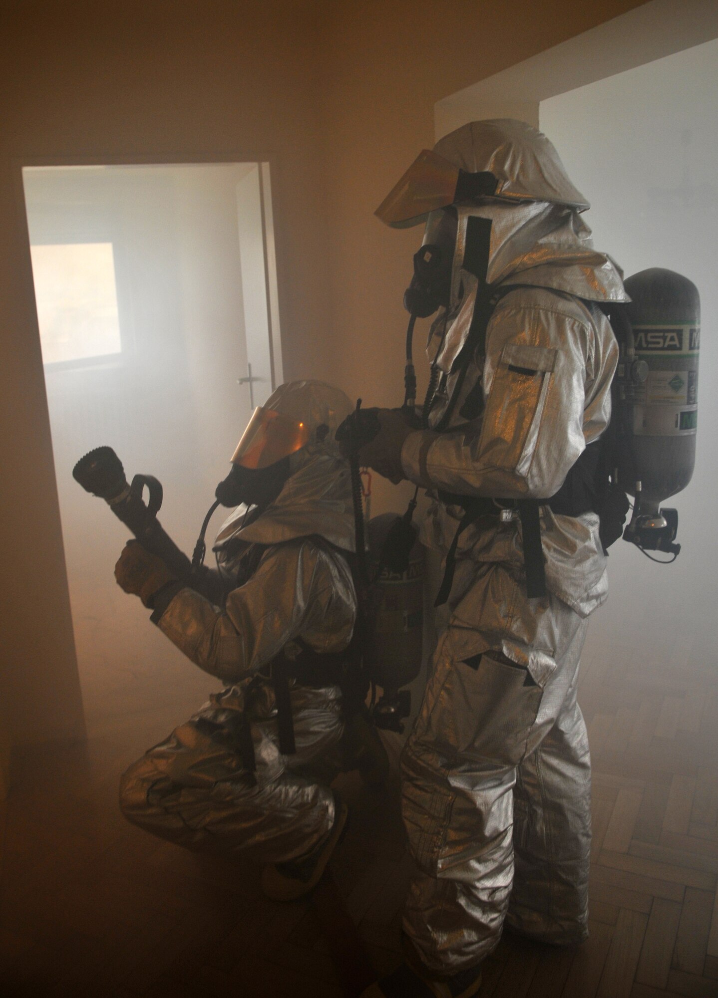 SPANGDAHLEM AIR BASE, Germany – Firefighters from the 52nd Civil Engineer Squadron respond to a simulated building fire during a mutual aid exercise at Bitburg Annex April 11. The exercise tested the 52nd Fighter Wing and Bitburg Freiwilige Feuerwehr fire departments’ ability to work together and respond to real-world fire emergencies. U.S. Air Force photo/Airman 1st Class Nick Wilson)