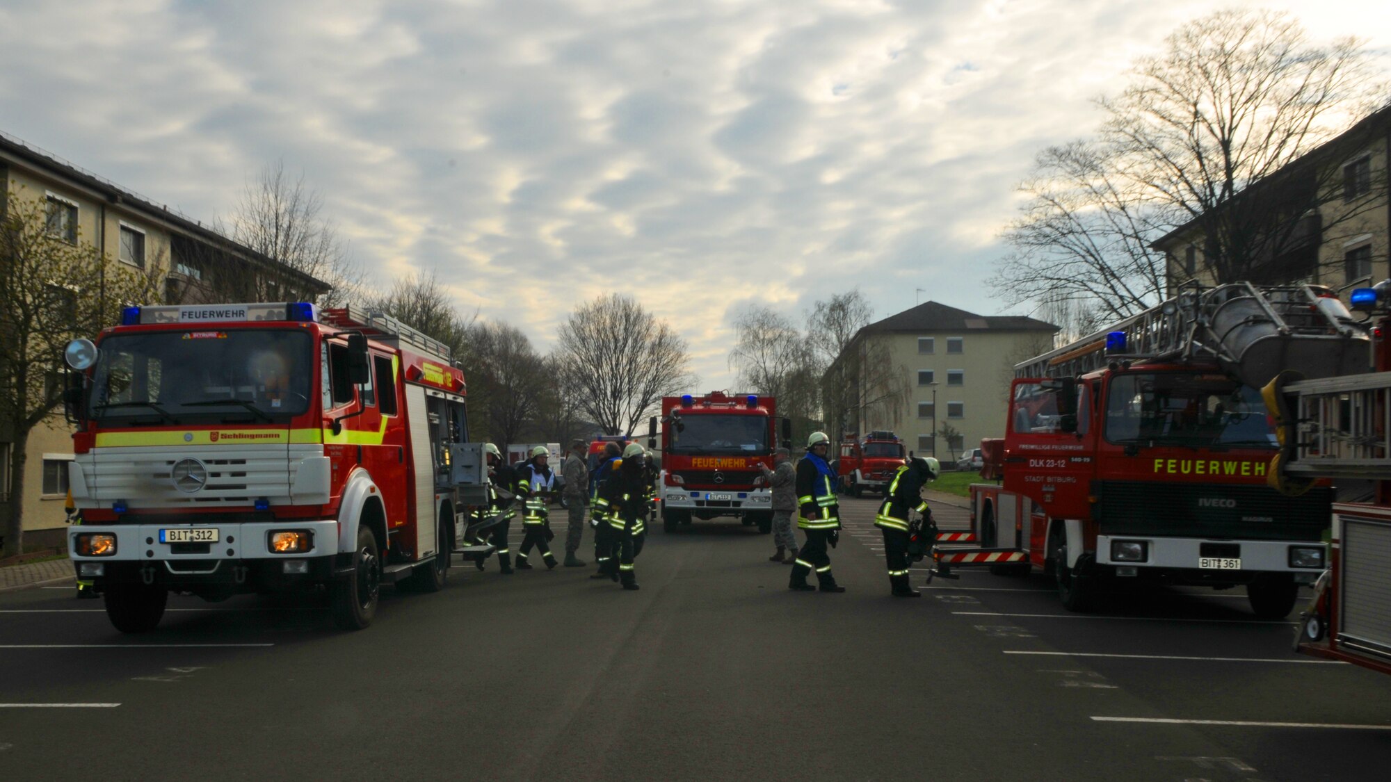 SPANGDAHLEM AIR BASE, Germany – Firefighters from the 52nd Civil Engineer Squadron respond to a simulated building fire with volunteers from the Bitburg Freiwilige Feuerwehr during a mutual aid exercise at Bitburg Annex April 11. The exercise tested the 52nd Fighter Wing and Bitburg Freiwilige Feuerwehr fire departments’ ability to work together and respond to real-world fire emergencies. (U.S. Air Force photo/Airman 1st Class Nick Wilson)