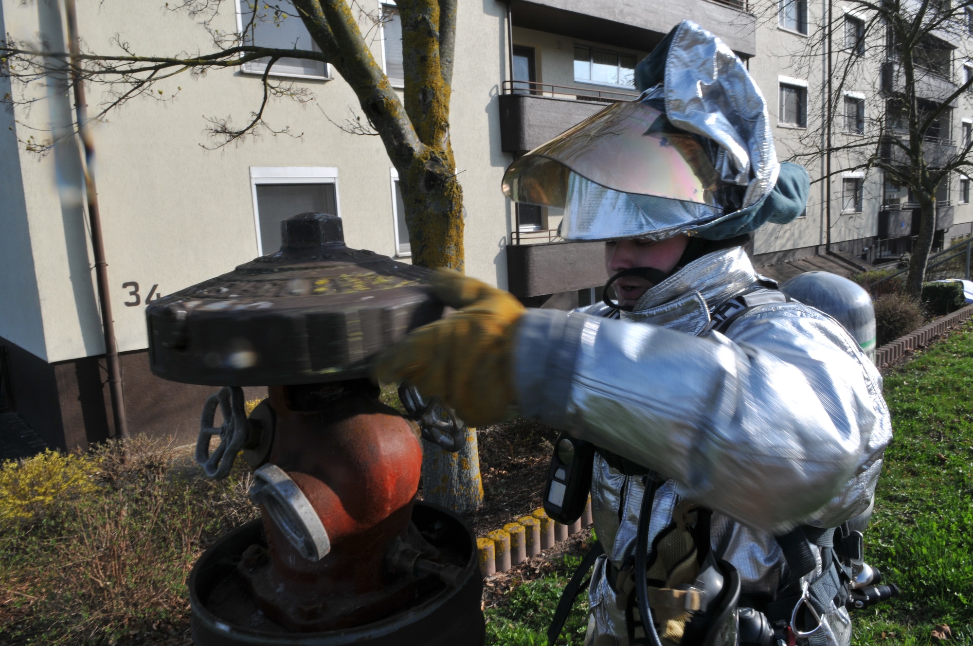 SPANGDAHLEM AIR BASE, Germany – Airman 1st Class Jonathan Douglas, 52nd Civil Engineer Squadron firefighter, connects a water hose to a fire hydrant during a mutual aid exercise at Bitburg Annex April 11. The exercise tested the 52nd Fighter Wing and Bitburg Freiwilige Feuerwehr fire departments’ ability to work together and respond to real-world fire emergencies. (U.S. Air Force photo/Airman 1st Class Nick Wilson)