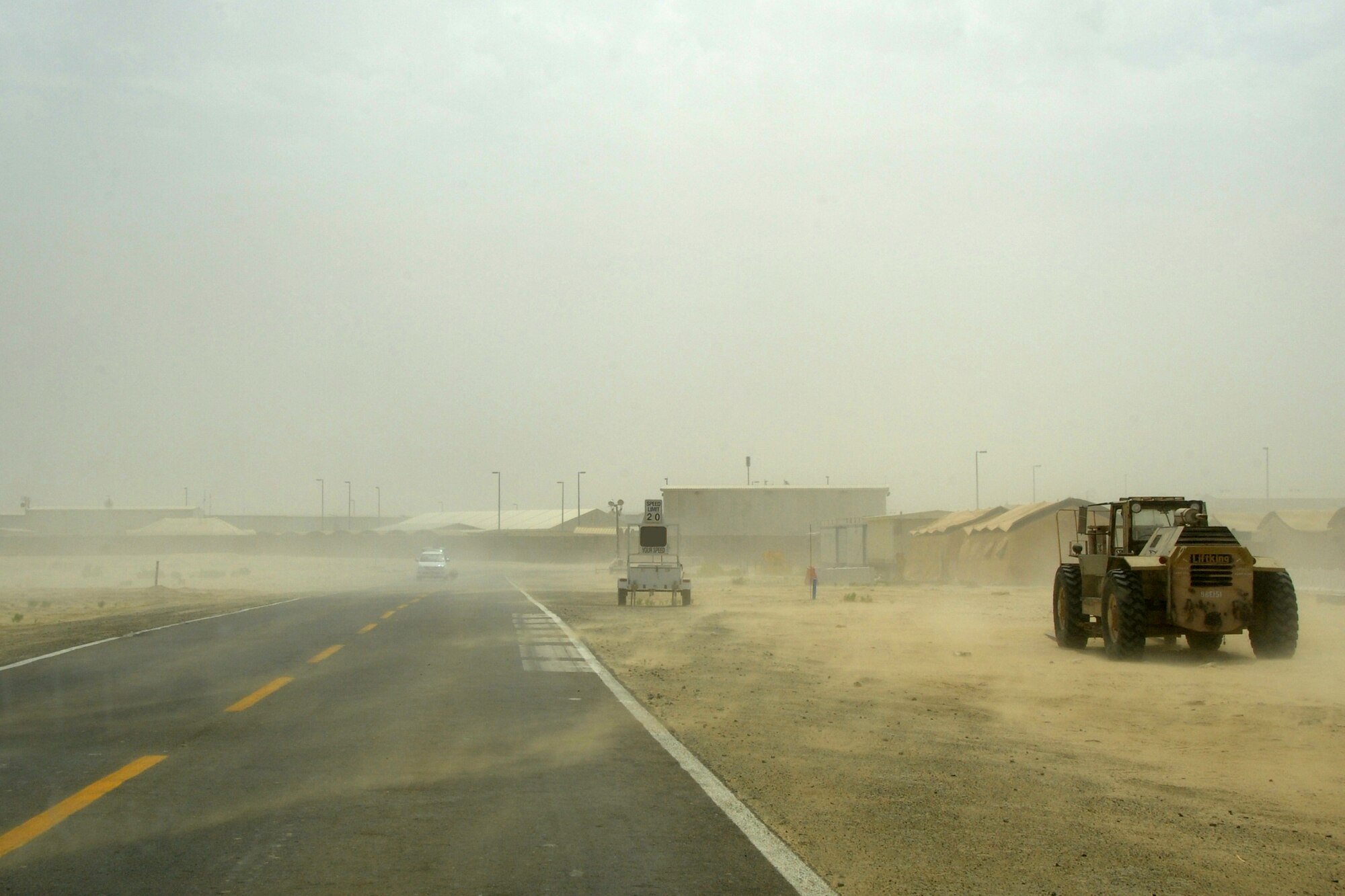 A standstorm strikes at the 380th Air Expedionary Wing April 13, 2010. The 380th AEW  recieved winds reaching 30 knots and as high as 36 knots the following day with visitbility being reduced to to as low as 400 meters. The 380th Air Expeditionary Wing, supports Operations Iraqi Freedom and Enduring Freedom and the Combined Joint Task Force-Horn of Africa. The 380th AEW is comprised of four groups and 12 squadrons and the wing's deployed mission includes air refueling, surveillance and reconnaissance in support of overseas contingency operations in Southwest Asia. (U.S. Air Force photo/Senior Airman Jenifer H. Calhoun/Released)
