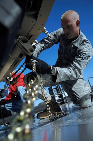 Airman 1st Class Koy Sauer secures a mine-resistant, ambush-protected all-terrain vehicle to a pallet at the 437th Aerial Port Squadron  March 23, 2010, at Joint Base Charleston, S.C. The M-ATVs are being transported downrange to support Marine operations in support of Operation Enduring Freedom. Airman Sauer is an air transportation technician with the 437th Aerial Port Squadron. (U.S. Air Force photo/Senior Airman Timothy Taylor)