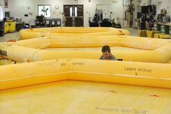 Airman Dustin Campbell performs a leakage test on a raft in the 437th Operations Support Squadron float section on Joint Base Charleston, S.C., April 7, 2010. The rafts are used during aircrew water survival training and leak tests ensure their serviceability. Airman Campbell is an aircrew flight equipment apprentice with the 437 OSS. (U.S. Air Force photo/Senior Airman Jennifer Flores)