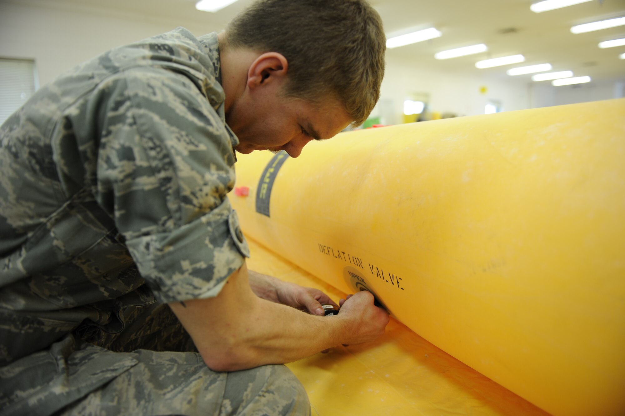 Airman Dustin Campbell performs a leakage test on a raft in the 437th Operations Support Squadron float section on Joint Base Charleston, S.C., April 7, 2010. The rafts are used during aircrew water survival training and leak tests ensure their serviceability. Airman Campbell is an aircrew flight equipment apprentice with the 437 OSS. (U.S. Air Force photo/Senior Airman Jennifer Flores)