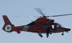 U.S. Air Force Capt. Matthew Slupski is raised out of the water in the Charleston Harbor in Charleston, S.C., during Survival, Evasion, Resistance and Escape training April 5, 2010. All pilots and aircrew are required to stay current with their water survival training and take the course once every three years. The U.S. Coast Guard uses the class as an opportunity to train their own rescue teams to pull victims out of the water and administer proper care. Captain Slupski is a C-17 pilot with the 15th Airlift Squadron. (U.S. Air Force Photo/Airman 1st Class Lauren Main)