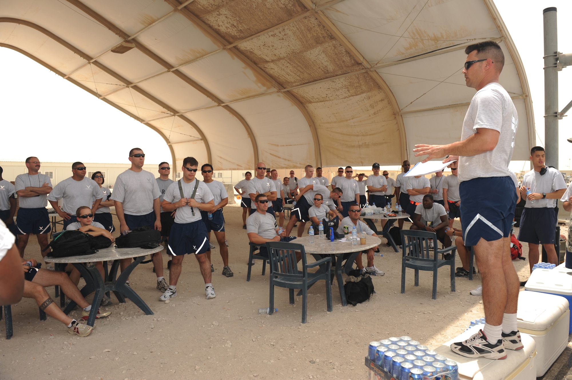Tech Sgt. Timothy Smith, 379th Expeditionary Civil Engineer Squadron fire inspector, gives a safety briefing to firefighter game competitors at a non-disclosed Southwest Asia location, Apr 10, 2010. The 379th Expeditionary Maintenance Squadron ammo team won the competition. (U.S. Air Force photo by Tech. Sgt. Michelle Larche)[RELEASED]