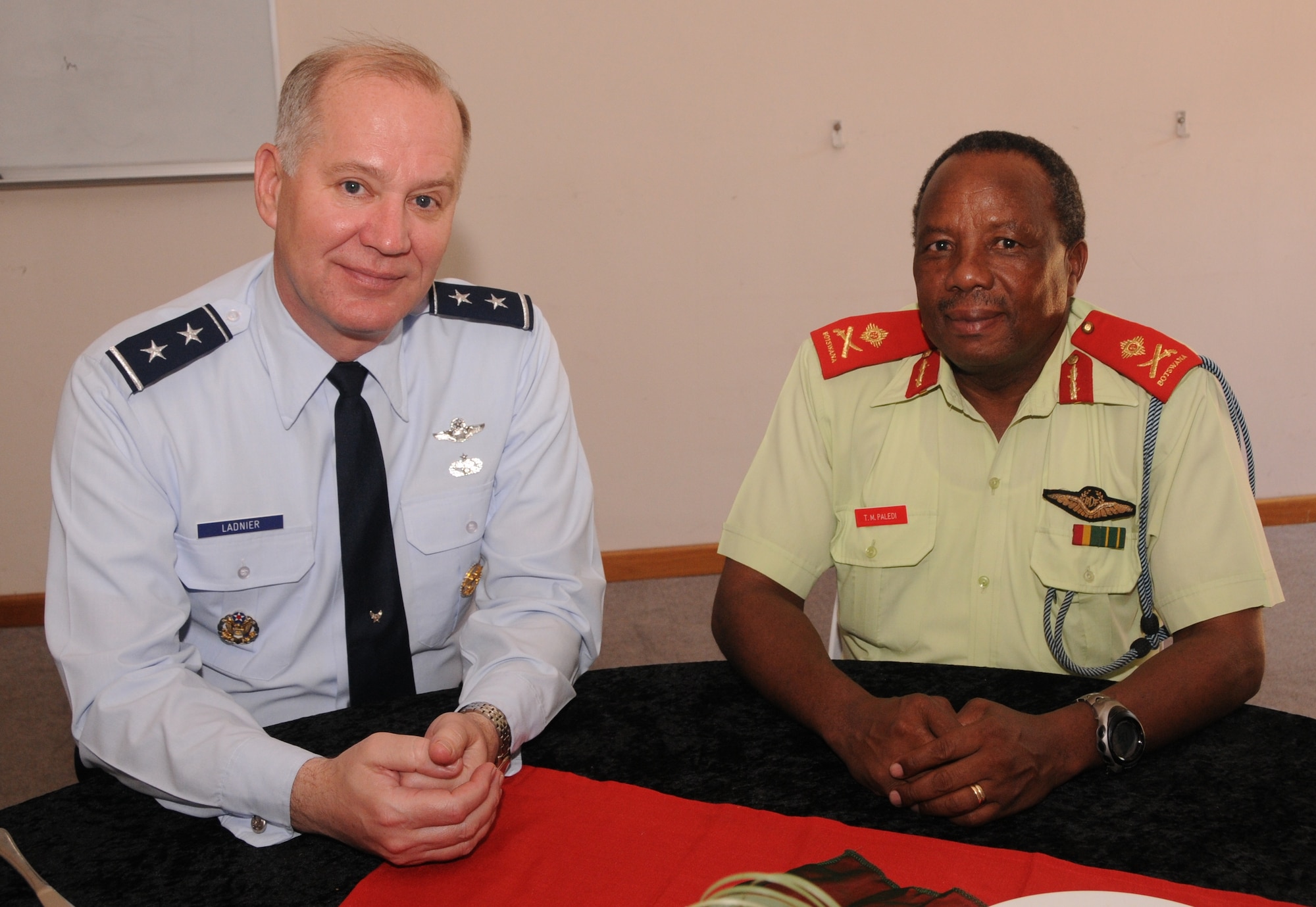 GABORONE, Botswana -- Maj. Gens. Ronald Ladnier, 17th Air Force (Air Forces Africa) commander, and T.M. Paledi, Botswana Defence Force Air Arm commander, pause during meetings March 10 here. The two discussed a number or air force-related topics, including professional development and the International Military Education and Training program during the AFAFRICA senior leader engagement March 10 and 11. (U.S. Air Force photo by Master Sgt. Jim Fisher)
