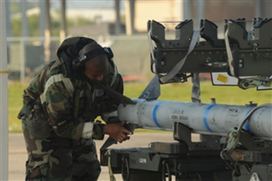 U.S. Air Force Senior Airman Hanson Blaylock with the Aircraft Maintenance Squadron, 159th Fighter Wing installs a tail fin on an AIM-120 AMRAAM missile during an operational readiness exercise at Naval Air Station - Joint Reserve Base New Orleans on April 12, 2010.  The AMRAAM is an advanced medium-range air-to-air missile that has an all-weather, beyond-visual-range capability.  