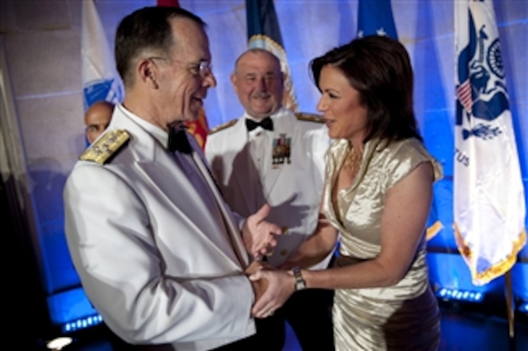 Chairman of the Joint Chiefs of Staff Adm. Mike Mullen greets CNN anchor Kyra Phillips at the annual Tragedy Assistance Program for Survivors Gala at the Andrew W. Mellon Auditorium in Washington, D.C., on April 13, 2010.  The Tragedy Assistance Program for Survivors has assisted more than 25,000 grieving military families who have lost loved ones with emotional support, a national network of peer based support and crisis intervention.  