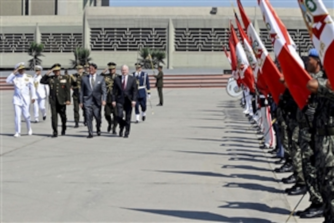 Peruvian Defense Minister Rafael Rey welcomes U.S. Defense Secretary Robert M. Gates with an honor cordon at the Ministry of Defense in Lima, Peru, as part of a four-day trip to South America and the Caribbean, April 14, 2010.