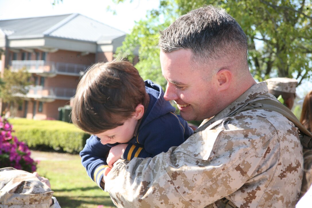 Lt. Col. Scott E. Pierce,  assistant chief of staff and director of safety and standardization with Marine Expeditionary Brigade-Afghanistan, Marine Aircraft Group 40, plays with his son at the air station’s chapel, April 15. ::r::::n::More than 100 Marines and Sailors returned home to Marine Corps Air Station Cherry Point from a 12-month deployment to Afghanistan. MAG-40, a Cherry Point based group comprised of seven squadrons, provided aviation support to MEB-Afghanistan during its deployment. The deployment was part of the 2009 troop build up in support of Operation Enduring Freedom.::r::::n::