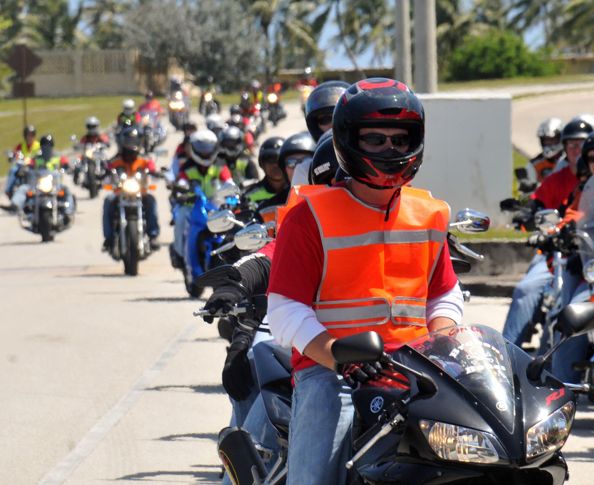 ANDERSEN AIR FORCE BASE, Guam ? More than  50 Airmen, civilians, and veterans from Andersen joined together April 14, for a motor-cycle group ride to bring attention to Sexual Assault Awareness Month. Participants in the ride made several stops throughout the day to include the commissary, the BX, and also off base Skinner Plaza. The riders were all donning the official SAAM T-shirt for 2010, the shirt was made from the winning entry, by Staff Sgt. Santana Forney of the 36 Communications Squadron,  for the SAAM shirt design contest. While making these stops they used their time to spread the word on sexual assault prevention and to pass out items related to it. The stop at Skinner Plaza also highlighted the partnership between Andersen?s SAAM and the Guam Coalition.  (U.S. Air Force photos by Airman 1st Class Julian L. North)