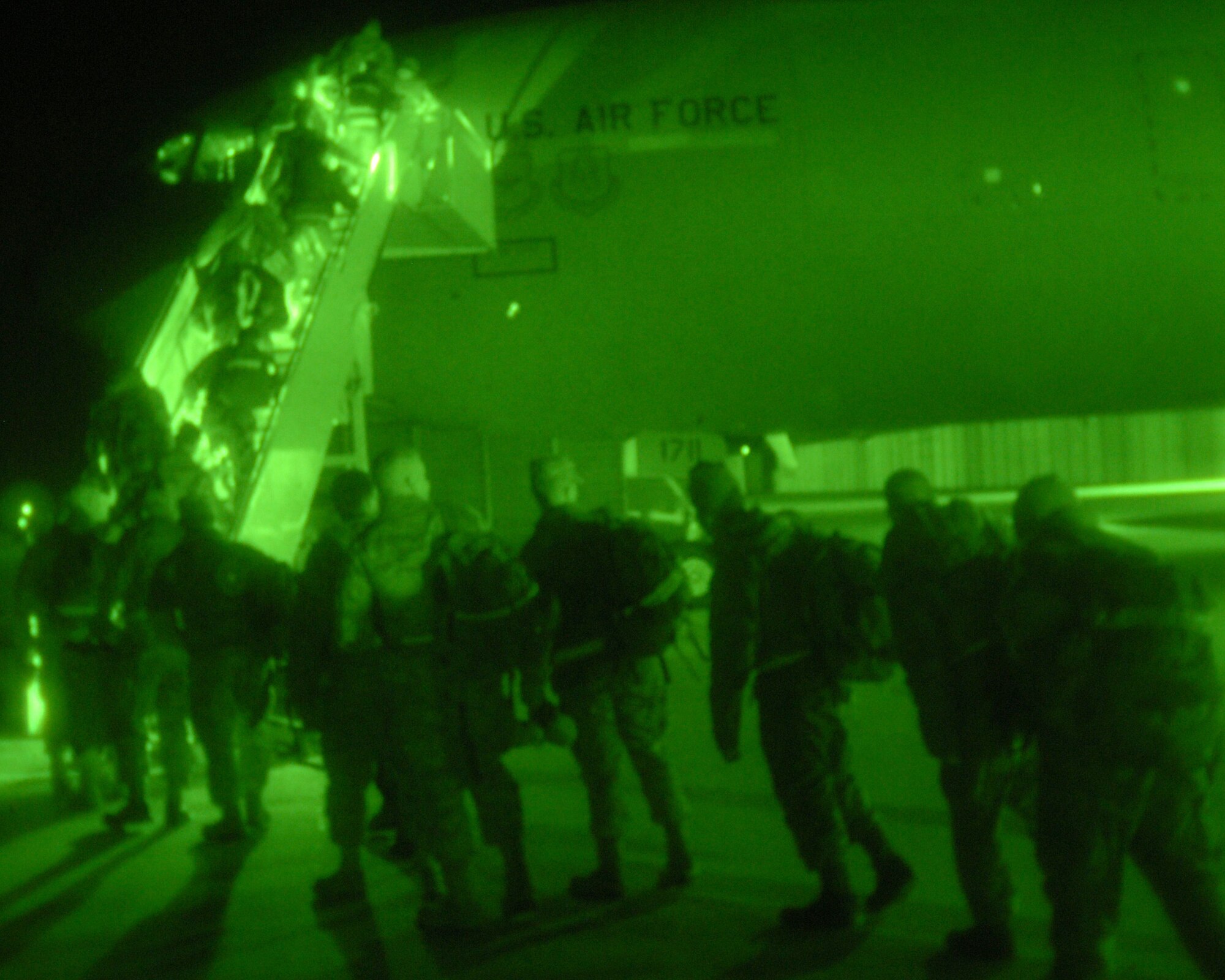 KUNSAN AIR BASE, Republic of Korea -- Wolf Pack members board a KC-10 Extender to depart for a Red Flag-Alaska Exercise April 12. Red Flag-Alaska is a 10-day air combat training exercise that provides joint offensive counter-air, interdiction, close air support and large force employment training in a simulated combat environment. The exercise provides an operations training environment for participants such as unit-level intelligence experts, pilots, maintenance crews and command and control elements. (U.S. Air Force photo/Senior Airman Roy Lynch)
