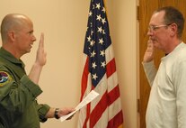 Master Sgt.Tom Lynch re-enlists, extending his 32-year military career. Colonel Jon Ellis, 940th Wing Operations Group Commander, administered the re-enlistment oath April 15 at 940th Wing Headquarters, Beale Air Force Base, Calif. Lynch is an Aerospace Ground Equipment Manager for the 13th Reconnaissance Squadron. (U.S. Air Force Photo/Airman 1st Class Adam Hamar)