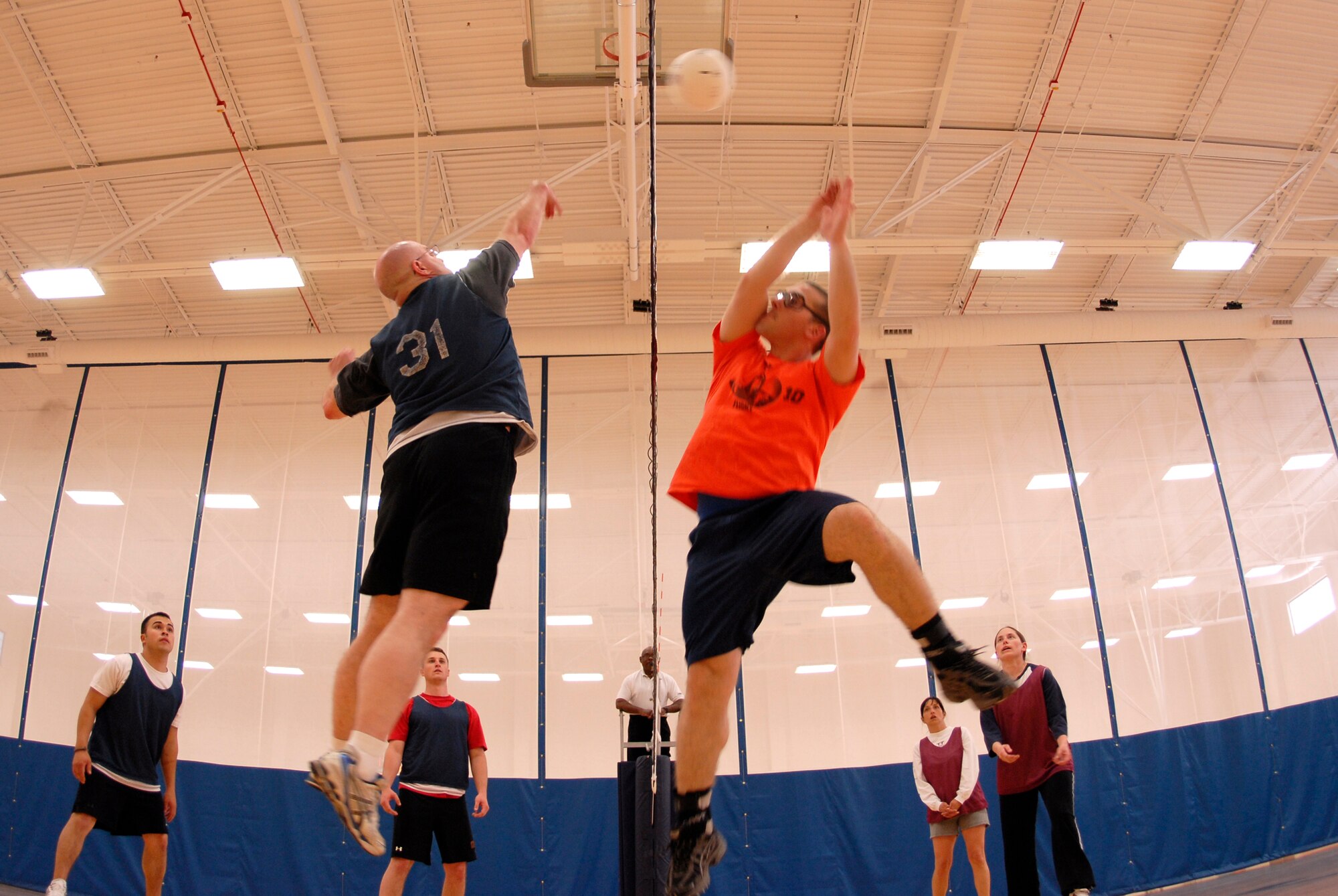 VANDENBERG AIR FORCE BASE, Calif. -- Leaping for the ball, John Shade, a 30th Logistics Readiness Squadron team member, jumps to spike the ball during an intramural volleyball game at the base fitness center here Tuesday, April 13, 2010. Both teams compete in the Tuesday and Thursday league. (U.S. Air Force photo/Senior Airman Andrew Satran) 

 

 

 
 

 

 

 

 