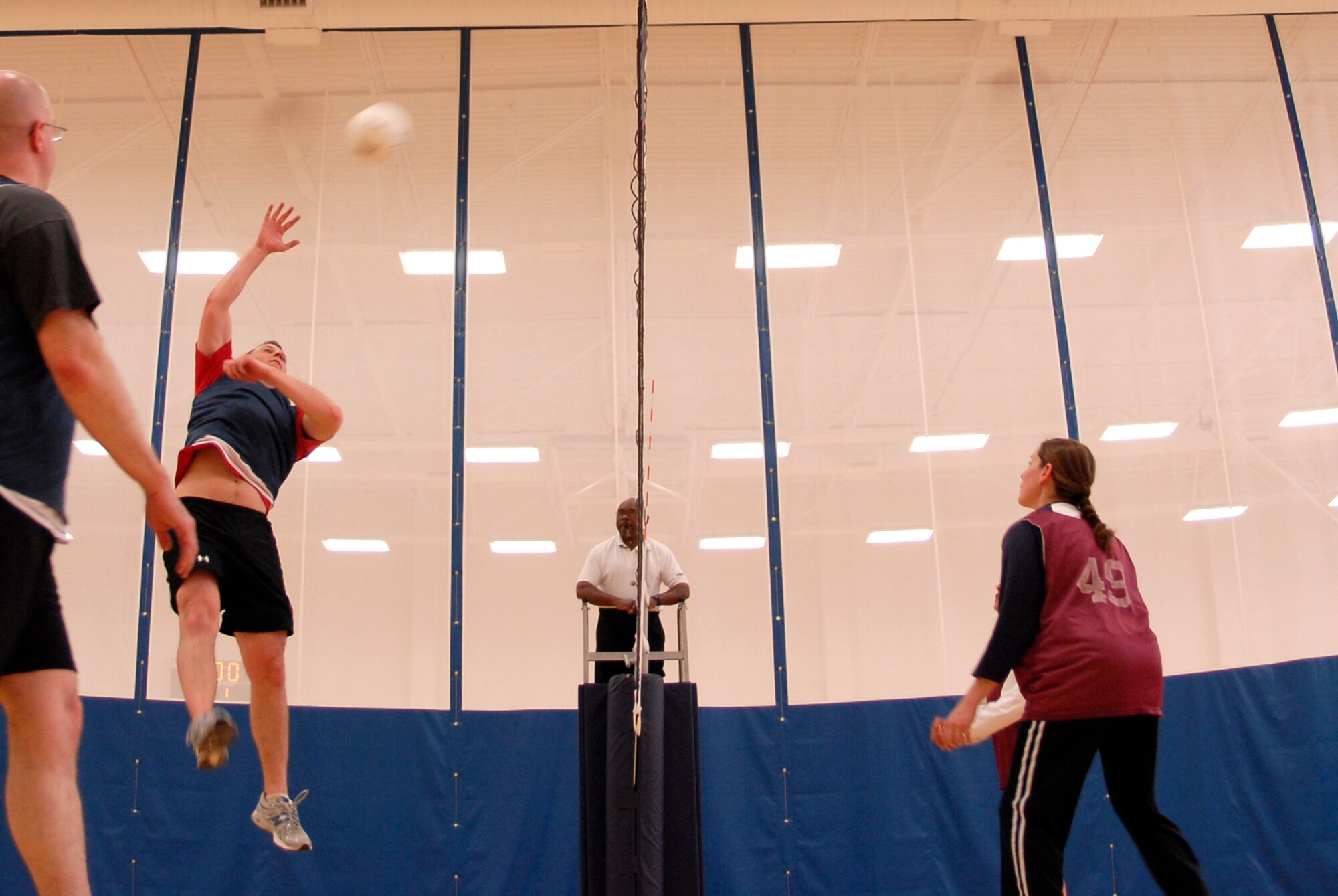 VANDENBERG AIR FORCE BASE, Calif. -- Leaping for the ball, Talbert Knepshield, a 30th Logistics Readiness Squadron team member, jumps to spike the ball during an intramural volleyball game at the base fitness center here Tuesday, April 13, 2010. There are 12 teams competing this year in the intramural volleyball league. (U.S. Air Force photo/Senior Airman Andrew Satran) 

 

 
 

 

 

 

 