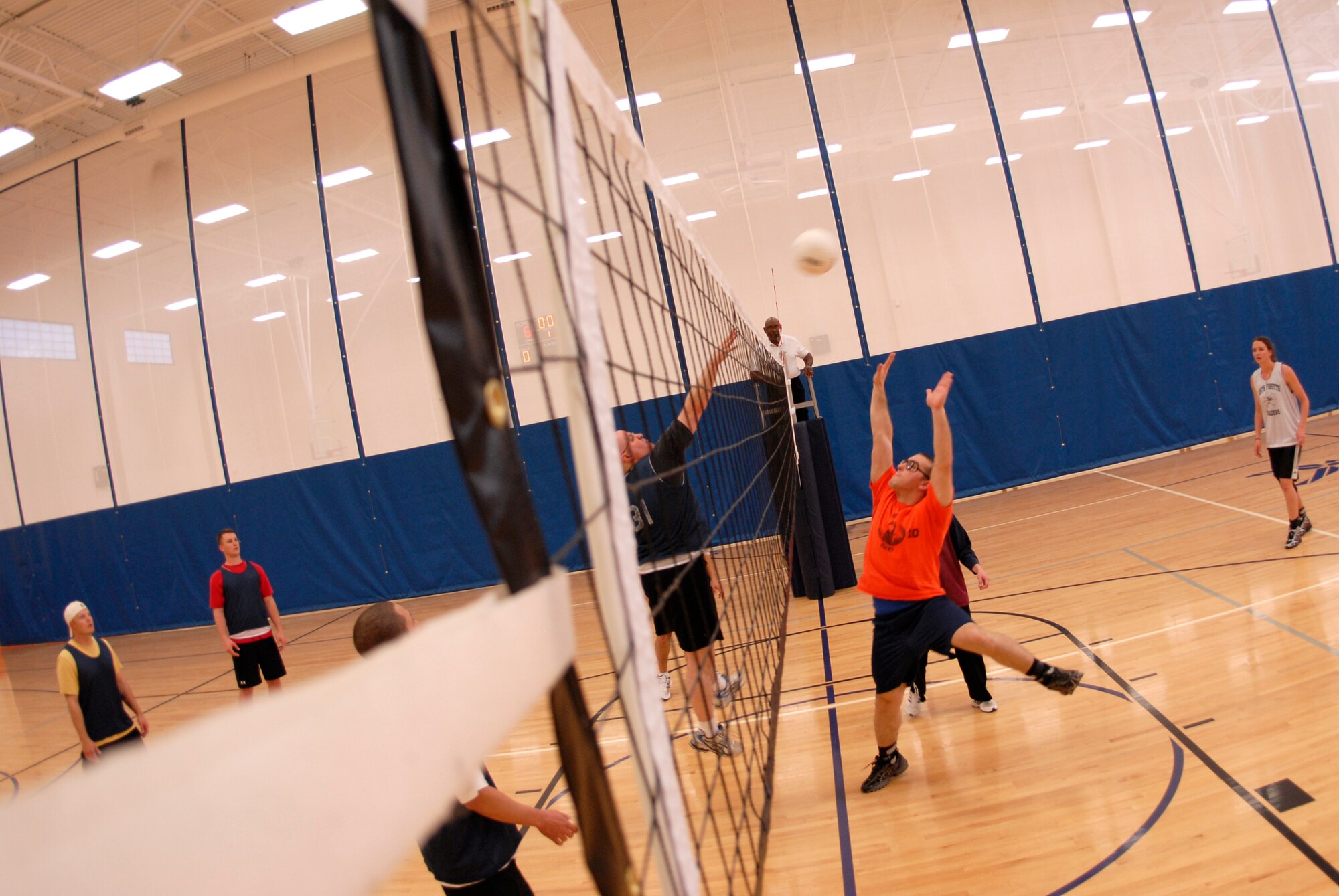 VANDENBERG AIR FORCE BASE, Calif. -- Spiking the ball, John Shade, a 30th Logistics Readiness Squadron team member, sends the ball above the reach of the 14th Air Force Team 2 during an intramural volleyball game at the base fitness center here Tuesday, April 13, 2010. The teams are now halfway through their seasons. (U.S. Air Force photo/Senior Airman Andrew Satran) 

 
 

 

 

 

 