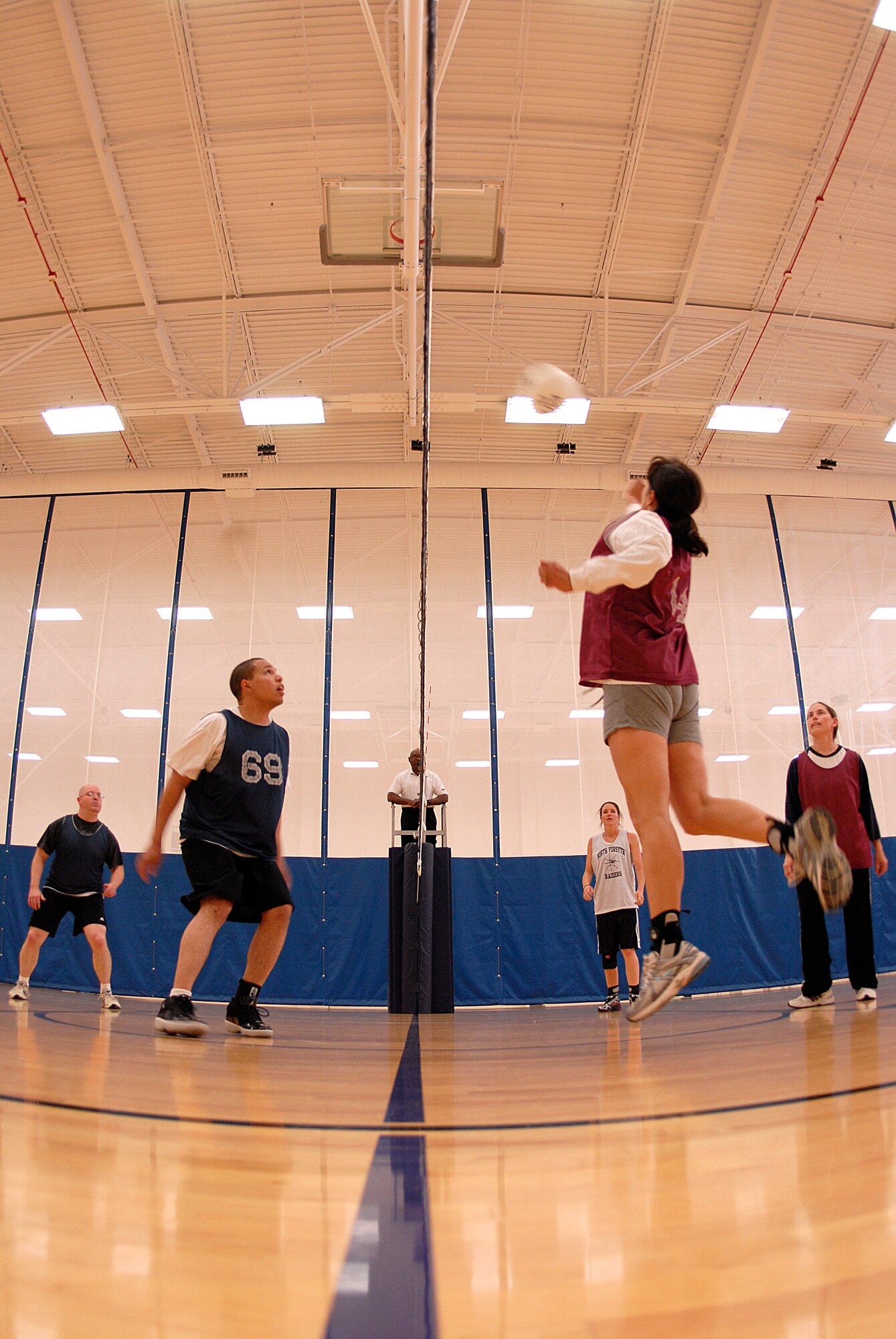 VANDENBERG AIR FORCE BASE, Calif. -- Angela Diamanti, a 14th Air Force Team 2 team member, leaps to hit the ball during an intramural volleyball game at the base fitness center here Tuesday, April 13, 2010.  The 30th LRS team won both matches, 25-10 and 25-12. (U.S. Air Force photo/Senior Airman Andrew Satran) 

 

 

 

 

 