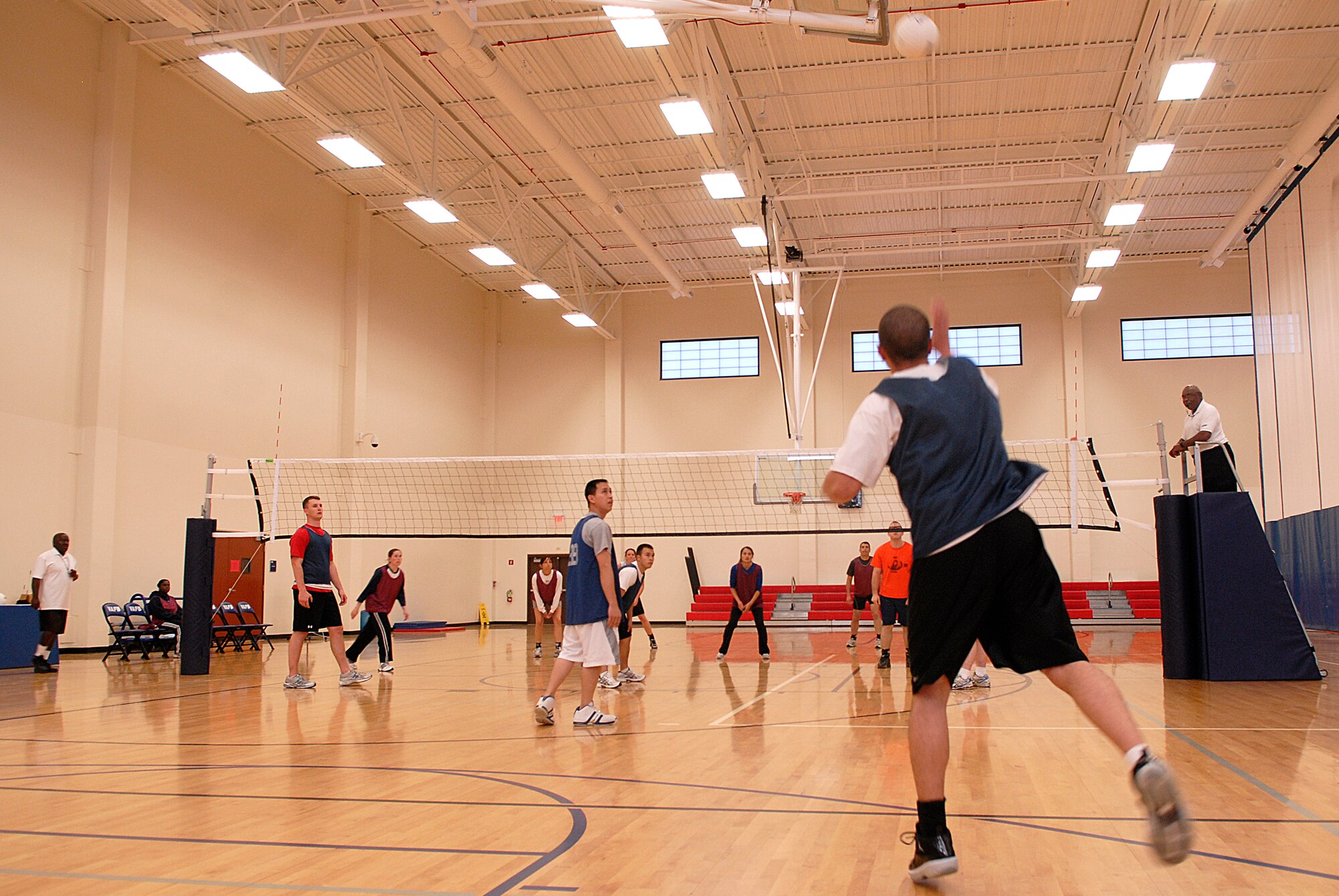 VANDENBERG AIR FORCE BASE, Calif. -- Serving for the 30th Logistics Readiness Squadron team, Marques Martin smacks the ball over to the 14th Air Force Team 2 during an intramural volleyball game at the base fitness center here Tuesday, April 13, 2010.  The teams switch sides of the volleyball court after every game is completed. (U.S. Air Force photo/Senior Airman Andrew Satran) 

 

 

 

 