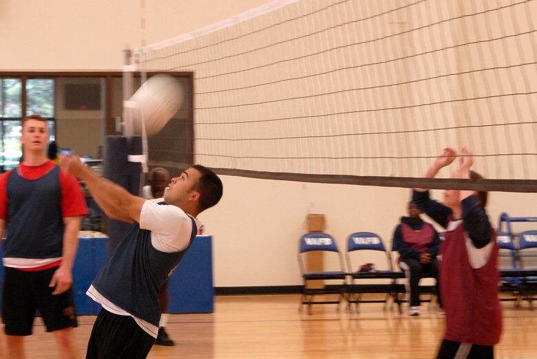 VANDENBERG AIR FORCE BASE, Calif. -- Returning the ball, Scott Gallegos, a 30th Logistics Readiness Squadron team member, volleys the ball back to his opponents during an intramural volleyball game at the base fitness center here Tuesday, April 13, 2010.  The 30th LRS team won both matches, 25-10 and 25-12.  (U.S. Air Force photo/Senior Airman Andrew Satran) 

 

 

 