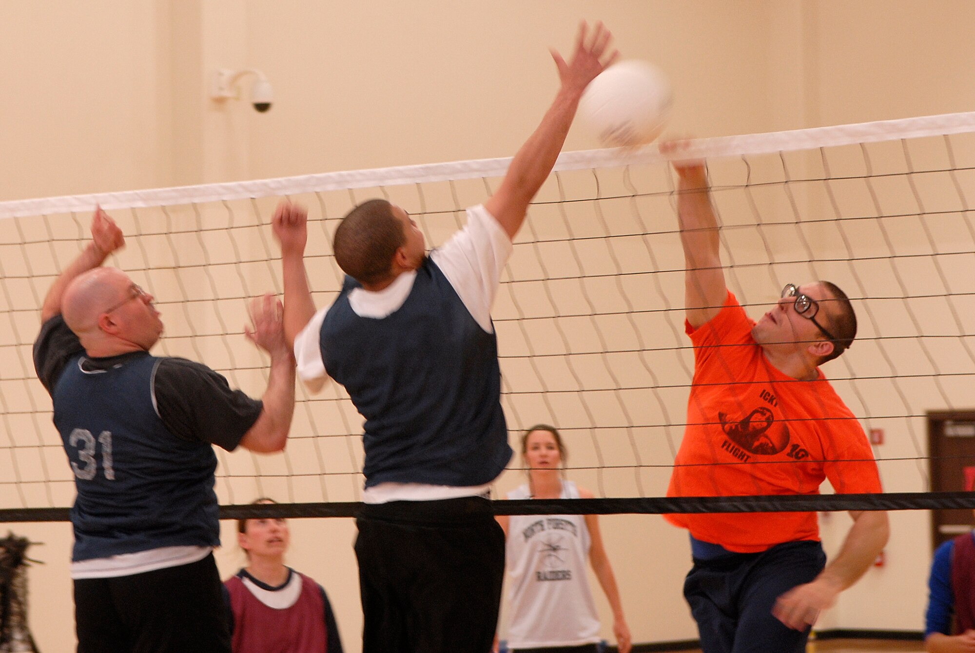 VANDENBERG AIR FORCE BASE, Calif. -- William Cosgrove, a 14th Air Force Team 2 team member, spikes the ball against the 30th Logistics Readiness Squadron team during an intramural volleyball game at the base fitness center here Tuesday, April 13, 2010.  The 30th LRS team won both matches, 25-10 and 25-12.  (U.S. Air Force photo/Senior Airman Andrew Satran) 

 