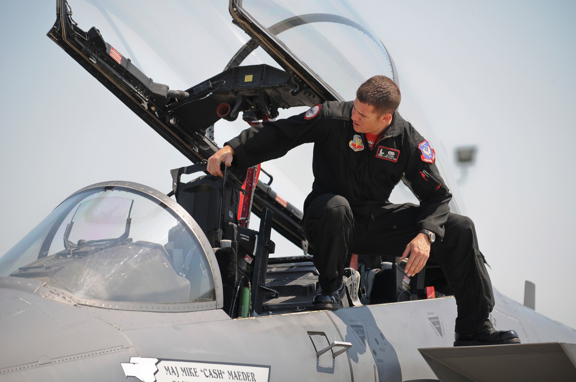 Senior Airman Brandon Rhodes, a crew chief with the U.S. Air Force Strike Eagle Demo Team, climbs into the cockpit of an F-15 fighter jet at the Kentucky Air National Guard Base in Louisville, Ky.,  on April 15, 2010. Airman Rhodes and the rest of the Strike Eagle Demo Team are assigned to 4th Fighter Wing out of Seymor Johnson, Air Force Base, N.C. The team is in town for this weekend's Thunder Over Louisville Air Show.