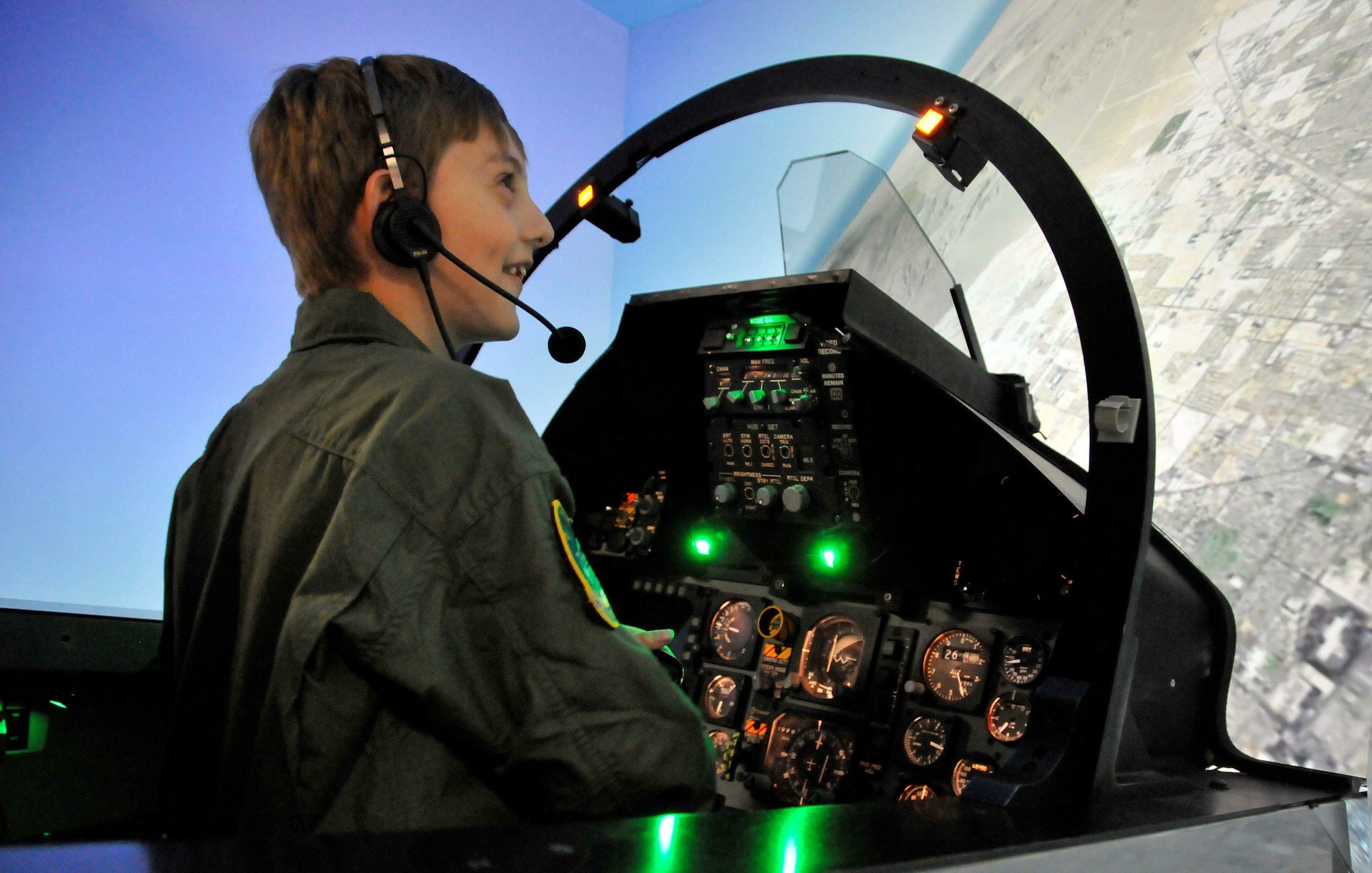 Isaac Ezell takes a ride in an F-15 Eagle simulator April 9, 2010, at the 95th Fighter Squadron while participating in the Pilot for a Day program at Tyndall Air Force Base, Fla. (U.S. Air Force photo/Lisa Norman)