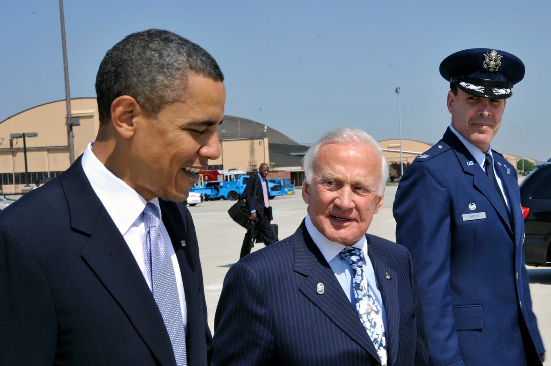 President Barack Obama, Apollo astronaut Buzz Aldrin and Col. Steven M. Shepro, 316th Wing/Joint Base Andrews, walk toward Air Force One, April 15, 2010, at Joint Base Andrews, Md. President Obama left for the Kennedy Space Center in Cape Canaveral, Fla., to announce his new space program. (U.S. Air Force photo by Airman 1st Class Perry Aston) (Released) 
