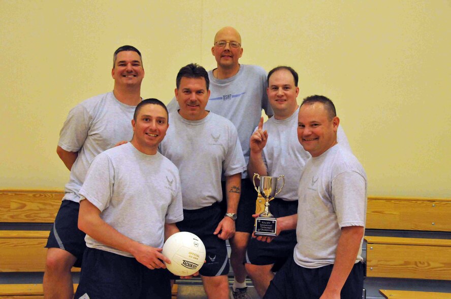 934th Services Squadron members display their trophy after winning the 934th Airlift Wing volleyball tournament at the Fitness Center April 10. (Air Force photo/Capt. S.J. Brown)