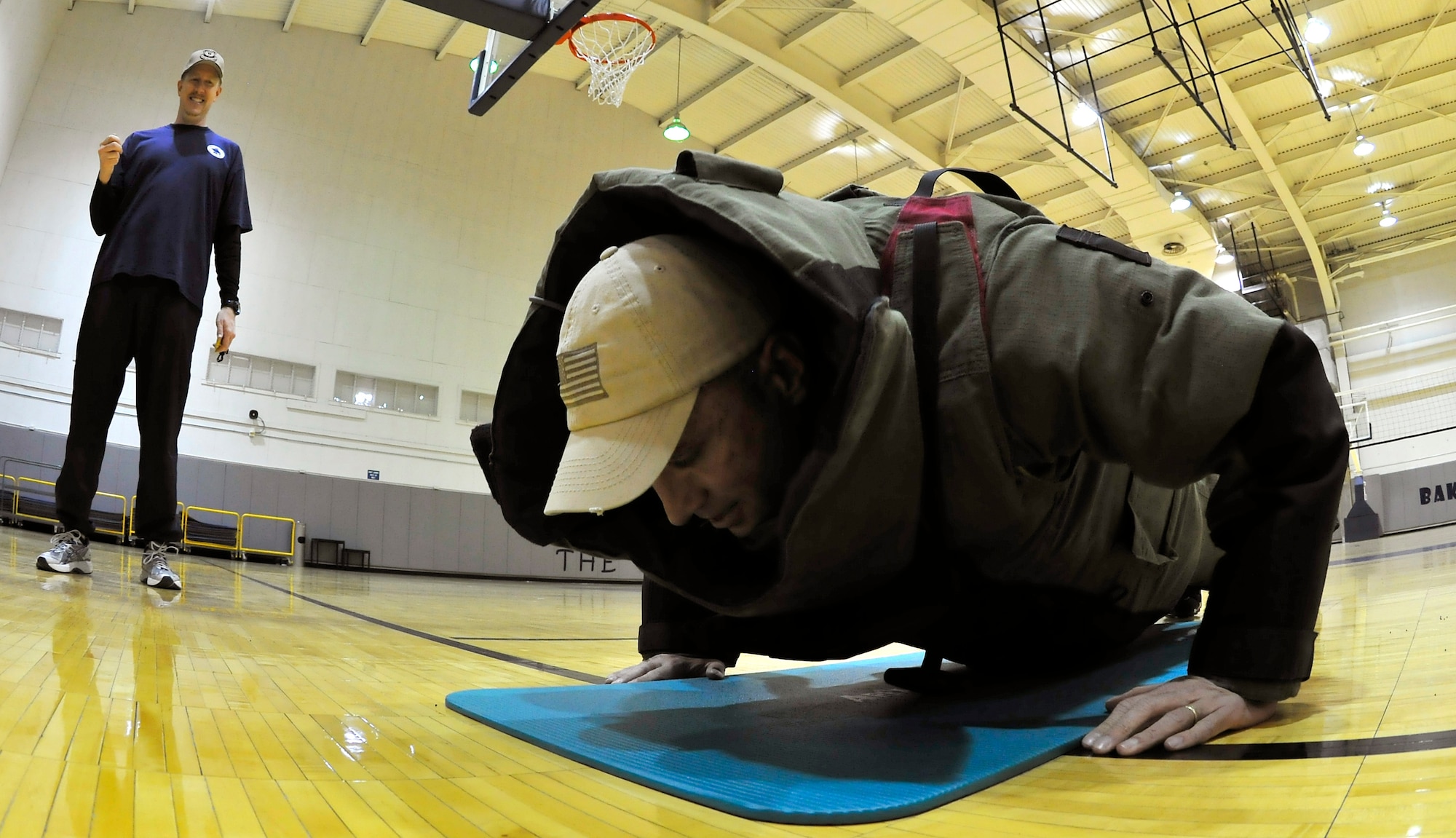 Master Sgt. Heath Tempel completes as many pushups as he in a bomb suit during the push up-a-thon April 14, 2010, Eielson Air Force Base, Alaska. The push up-a-thon, sponsored by the Eielson First Sergeant Council, helped raise money to support many of Team Eielson's base events. Sergeant Tempel is assigned to the 354th Civil Engineering Squadron explosive ordnance disposal flight. (U.S. Air Force photo/Staff Sgt. Christopher Boitz)