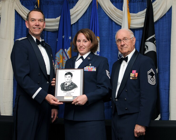 McGHEE TYSON AIR NATIONAL GUARD BASE, Tenn. -- Air Force Tech. Sgt. Kimberly D. Drummond, Wright-Patterson AFB, Ohio, receives the John L. Levitow honor award for NCO Academy Class 10-4 at The Air National Guard Training and Education Center here from, Maj. Gen. Patrick J. Moisio, deputy director of the Air National Guard, right, and retired Chief Master Sergeant of the Air Force Sam E. Parish, left, April 7, 2010.  The John L. Levitow award is the highest honor awarded a graduate of any Air Force enlisted professional military education course. (U.S. Air Force photo by Master Sgt. Kurt Skoglund/Released)
