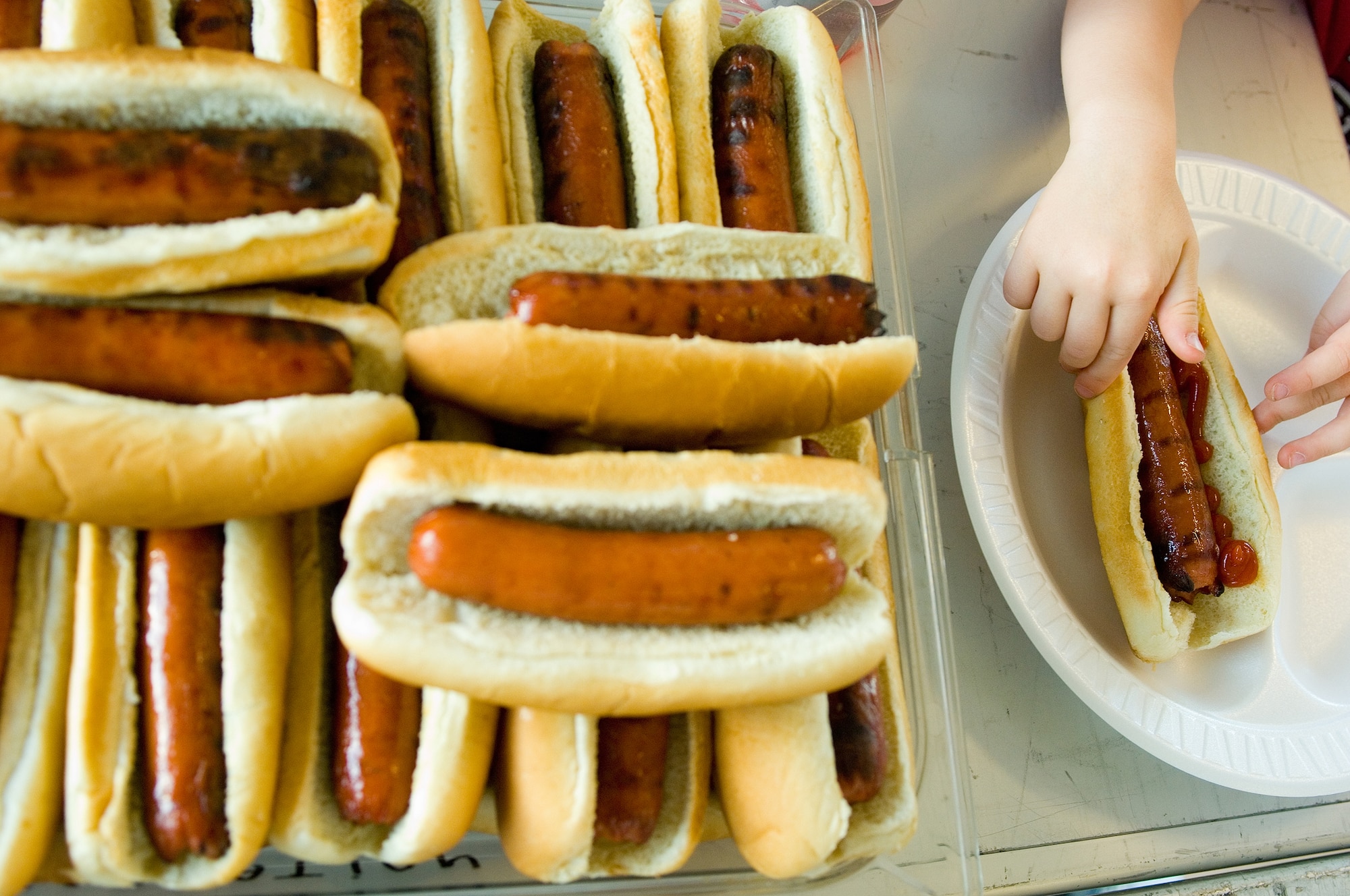 A participant of the Family Camp Out prepares their hot dog, the complementary dinner provided to those who signed up at Luke Air Force Base, Ariz.,Apr, 9, 2010. A movie and s'mores were also given at the camp out (U.S. Air Force Photo by Staff Sgt. Jason Colbert)