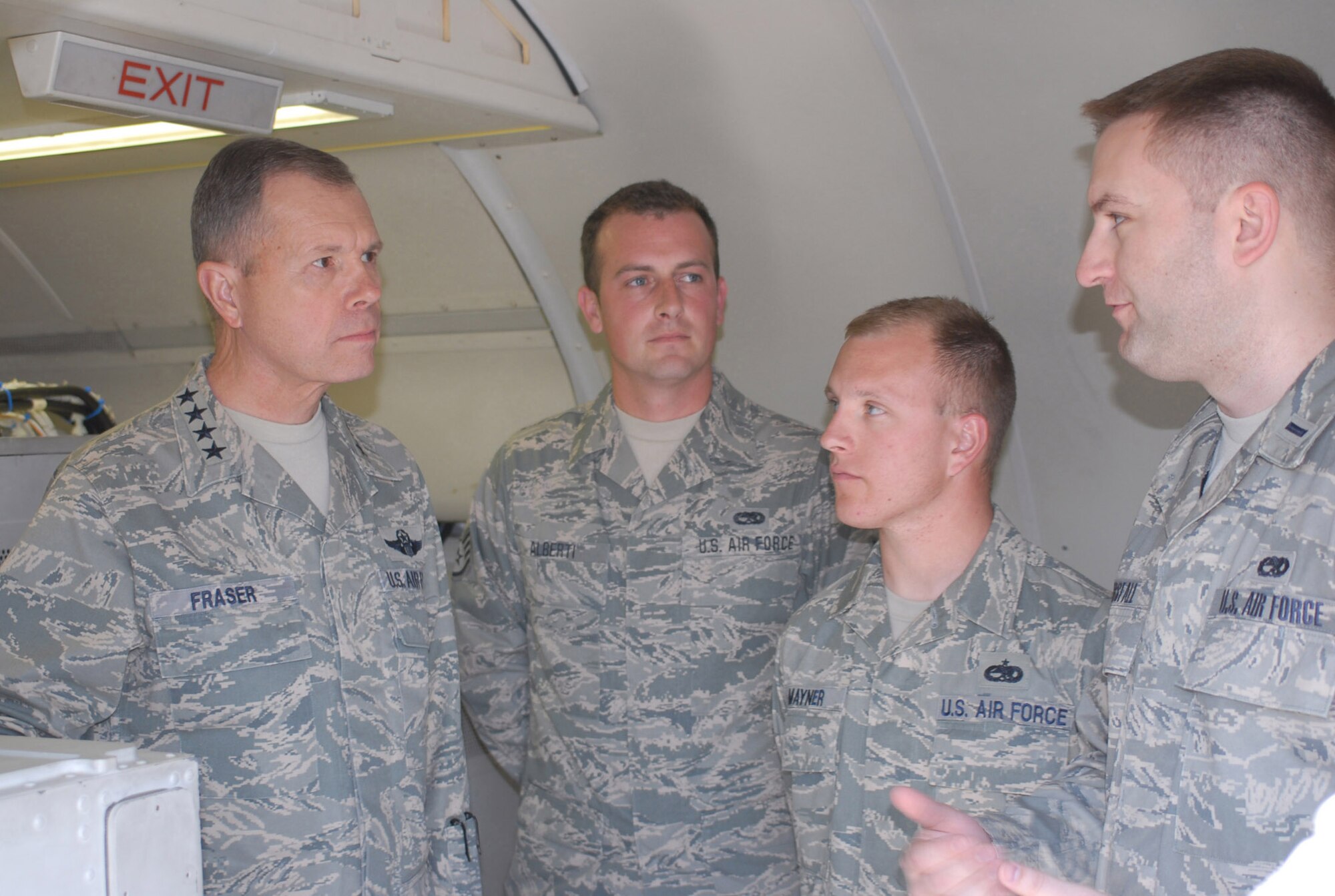 During his visit to the 116th  Air Control Wing, Gen. William M. Fraser III, commander of Air Combat Command, meets with 116th Maintenance Group personnel Staff Sgt. Mike Alberti, Staff Sgt. Rob Mayner and 1st Lt. Chris Horsfall to discuss JSTARS maintenance challenges in the AOR. (USAF Photo by MSgt Ada Thompson)