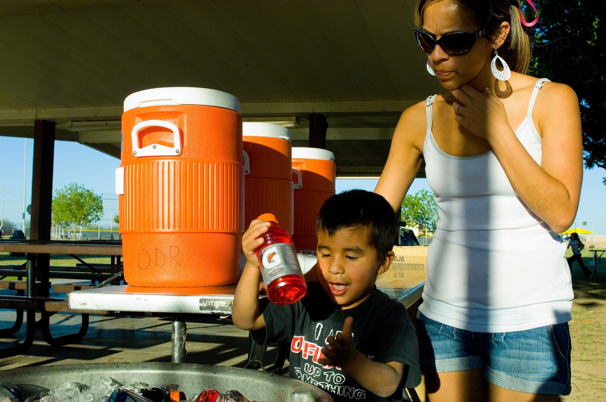 Tristan Reyna, son of Elsa Reyna, grabs a drink during the Family Camp Out at Luke Air Force Base, Ariz., April 9. Children were treated to punch balloons and beach balls with their dinner. (U.S. Air Force Photo by Staff Sgt. Jason Colbert)
