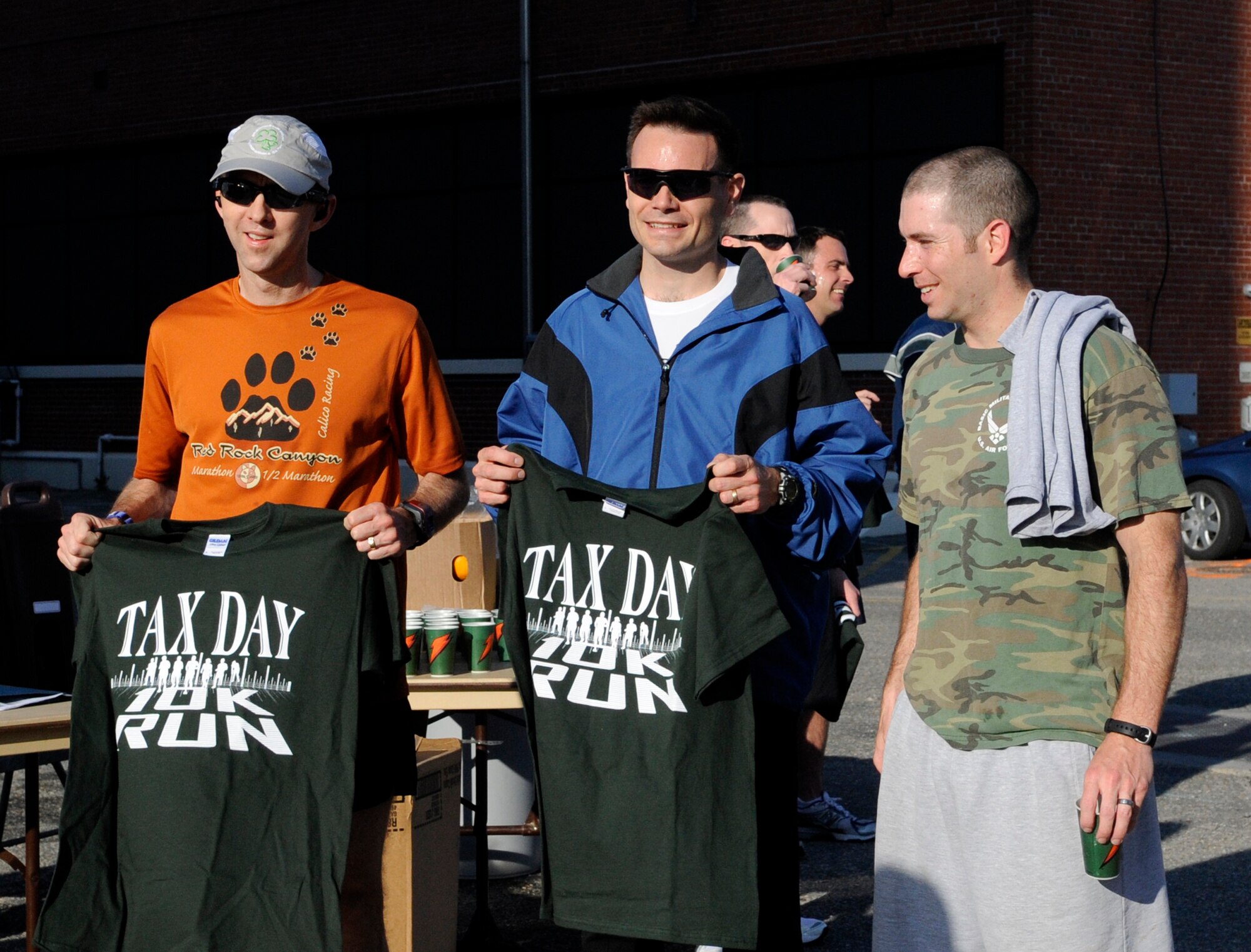 LANGLEY AIR FORCE BASE, Va. -Lt. Col. Chris Levy, Air Combat Command Training Support Squadron commander, Maj. Shane Vetter, Headquarters Air Combat Command, and 1st Lt. Jeremy Guest, 633d Civil Engineer Squadron, stand at the finish line during the Tax Day 10k run April 15. Colonel Levy, Major Vetter and Lieutenant Guest were the top three finalists. Approximately 60 members signed up for the fun run, which aimed to relieve stress and celebrate the completion of tax season. (U.S. Air Force photo/Senior Airman Dana Hill)
