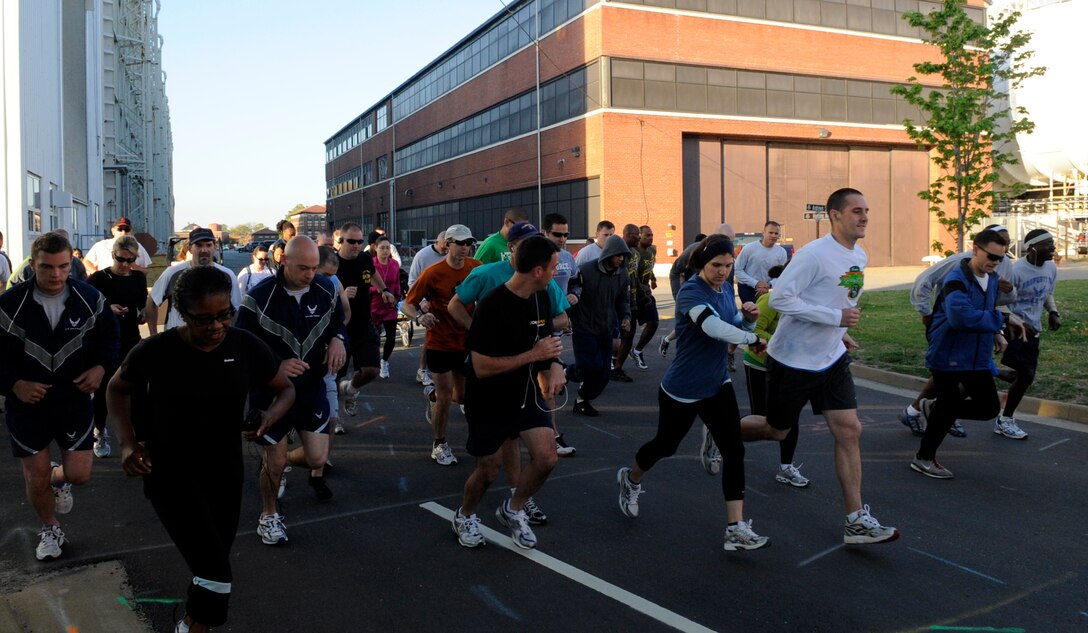 LANGLEY AIR FORCE BASE, Va. - Members of Team Langley takeoff from the start line during the Tax Day 10k run April 15. Approximately 60 members signed up for the fun run, which aimed to relieve stress and celebrate the completion of tax season. (U.S. Air Force photo/Senior Airman Dana Hill)