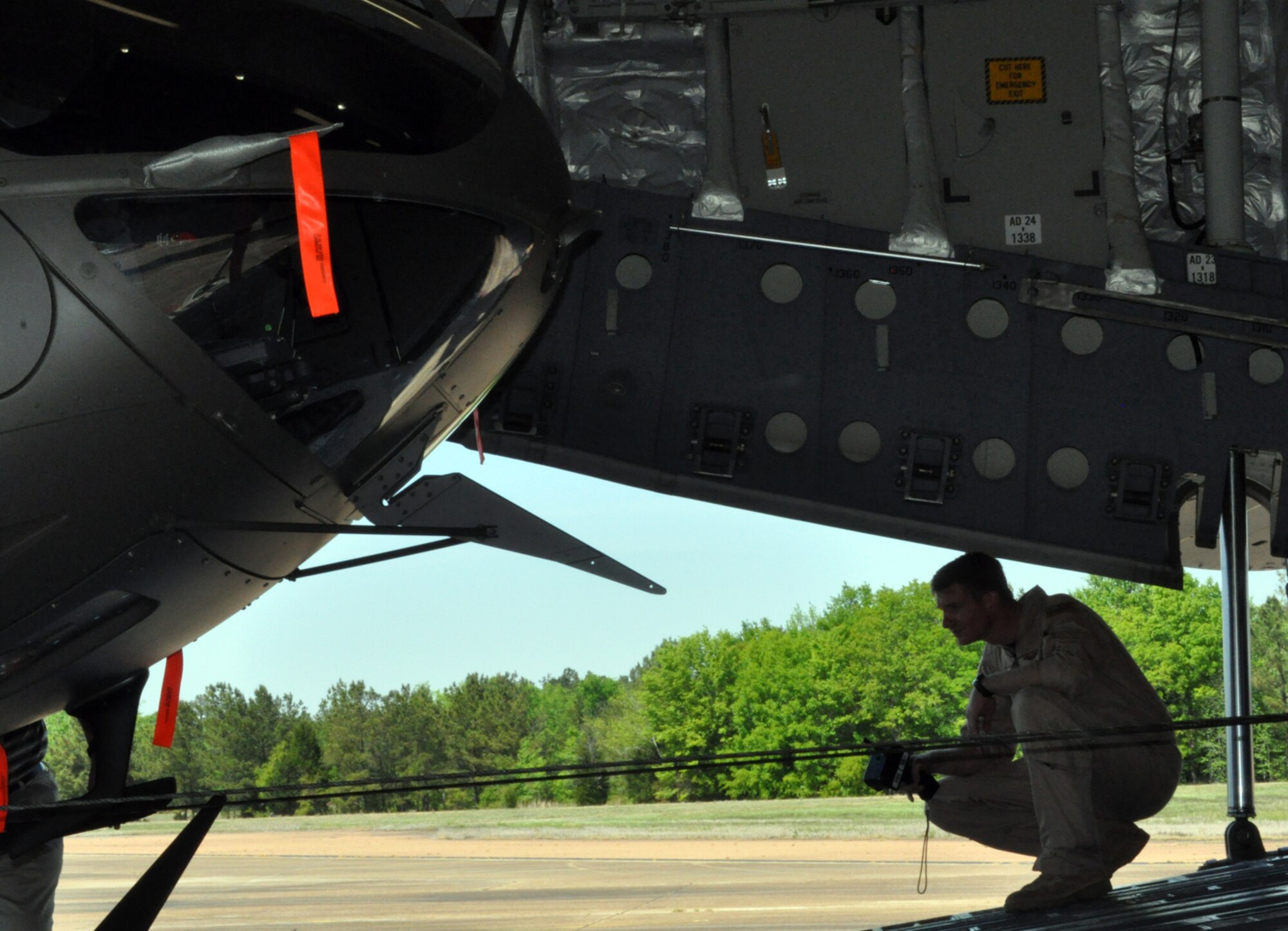 Tech. Sgt. Charles Boulton operates the winch on a C-17 Globemaster to pull a UH-72 Lakota into the aircraft April 12. Sergeant Boulton is a C-17 loadmaster assigned to the Air National Guard’s 172nd Airlift Wing in Jackson, Miss. (U.S. Air Force photo/Senior Airman Jacob Corbin). 