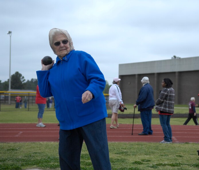 Mrs. Dorothy McKinzey, Fayetteville Resident, 87, throws the shot put during the 26th Annual Mid Carolina Senior Games held at the Pope Fitness Center, April 14. Other events during the Games included a football toss, 1500-Kilometer Race Walk and discuss throw. The Senior Games is a wellness a prevention program to keep the senior citizens’ bodies, minds and spirits fit while in the company of friends, family, spectators and volunteers. Pope has hosted the event for 26 years. (U.S. Air Force Photo/ 2nd Lt. Cammie Quinn)