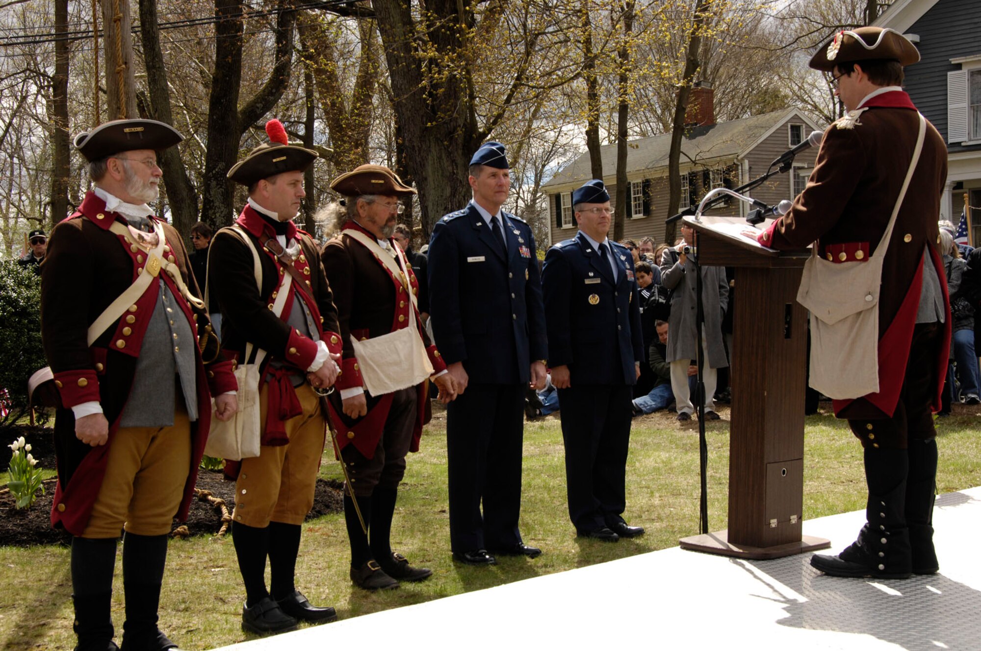 BEDFORD, Mass. – Lt. Gen. Ted F. Bowlds (second from right), Electronic Systems Center commander, and Col. Charles F. Thompson (right), 66th Air Base Wing commander, along with several Bedford Minuteman reenactors prepare to lay a wreath in honor of those minutemen and militia members who marched to Concord, Mass. on April 19, 1775 during the beginning of the Revolutionary War. (U.S. Air Force photo by Linda LaBonte Britt)