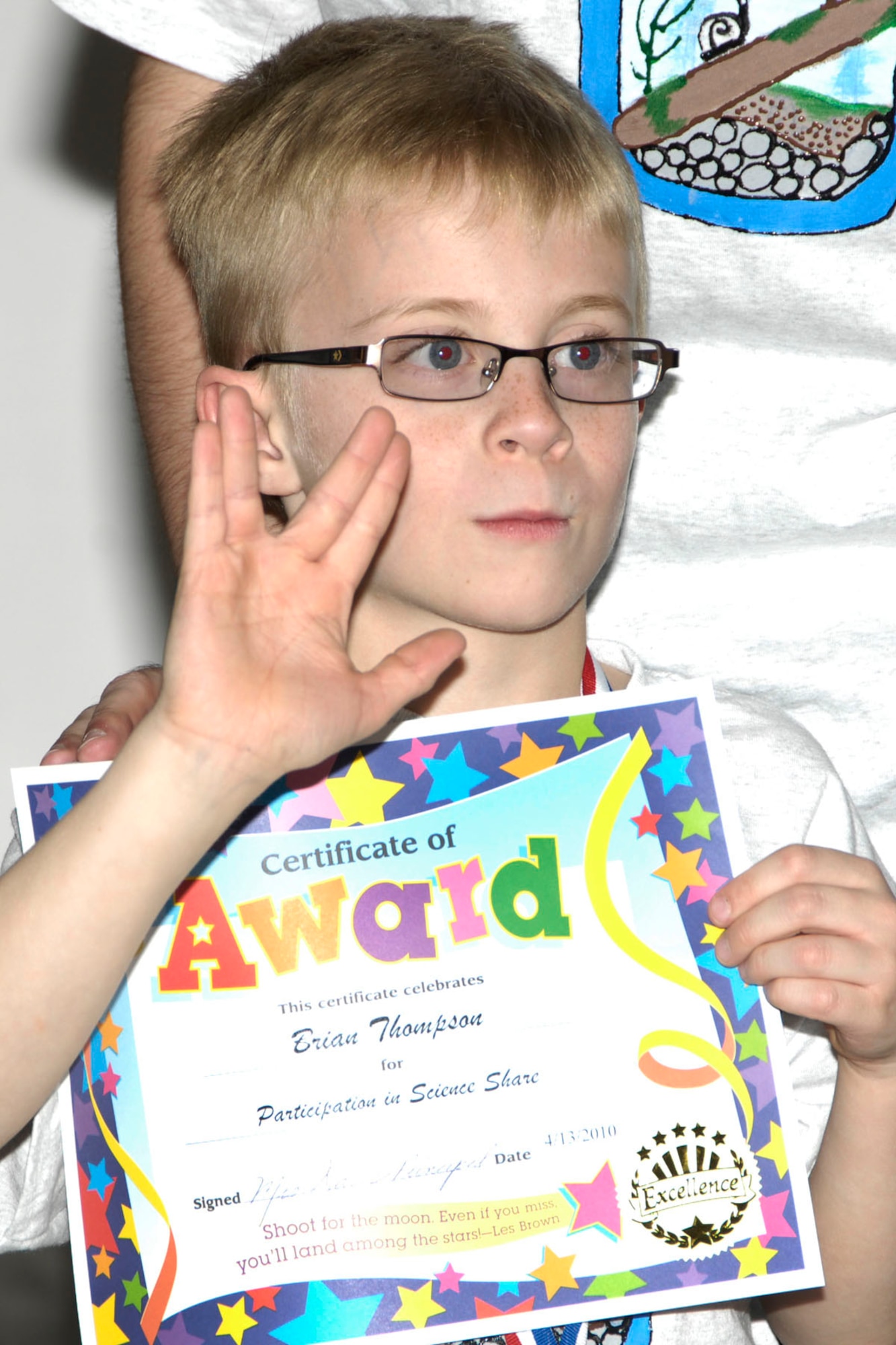 HANSCOM AIR FORCE BASE, Mass. – Brian Thompson, a member of the Ecosystems team, proudly accepts his certificate during the Hanscom Primary School’s non-competitive K-4 Science Share Fair on April 13. Students worked with volunteer coaches from the base to learn and discover new science topics through lessons, books and experiments. (U.S. Air Force photo by Linda LaBonte Britt)